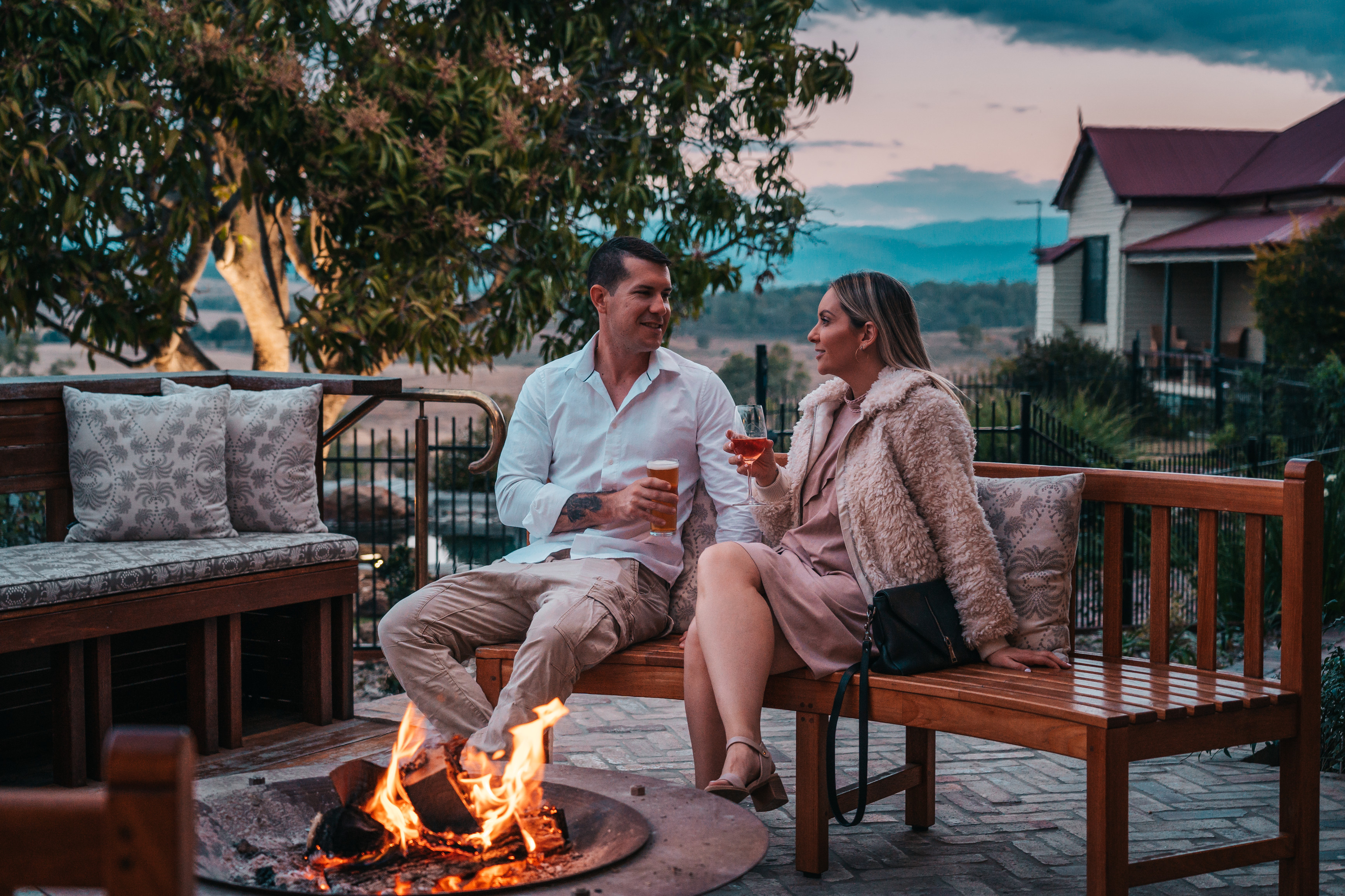 Pre-dinner drinks by the fire at Spicers Hidden Vale | winter accommodation Queensland Pre-dinner drinks by the fire at Spicers Hidden Vale | winter accommodation Queensland