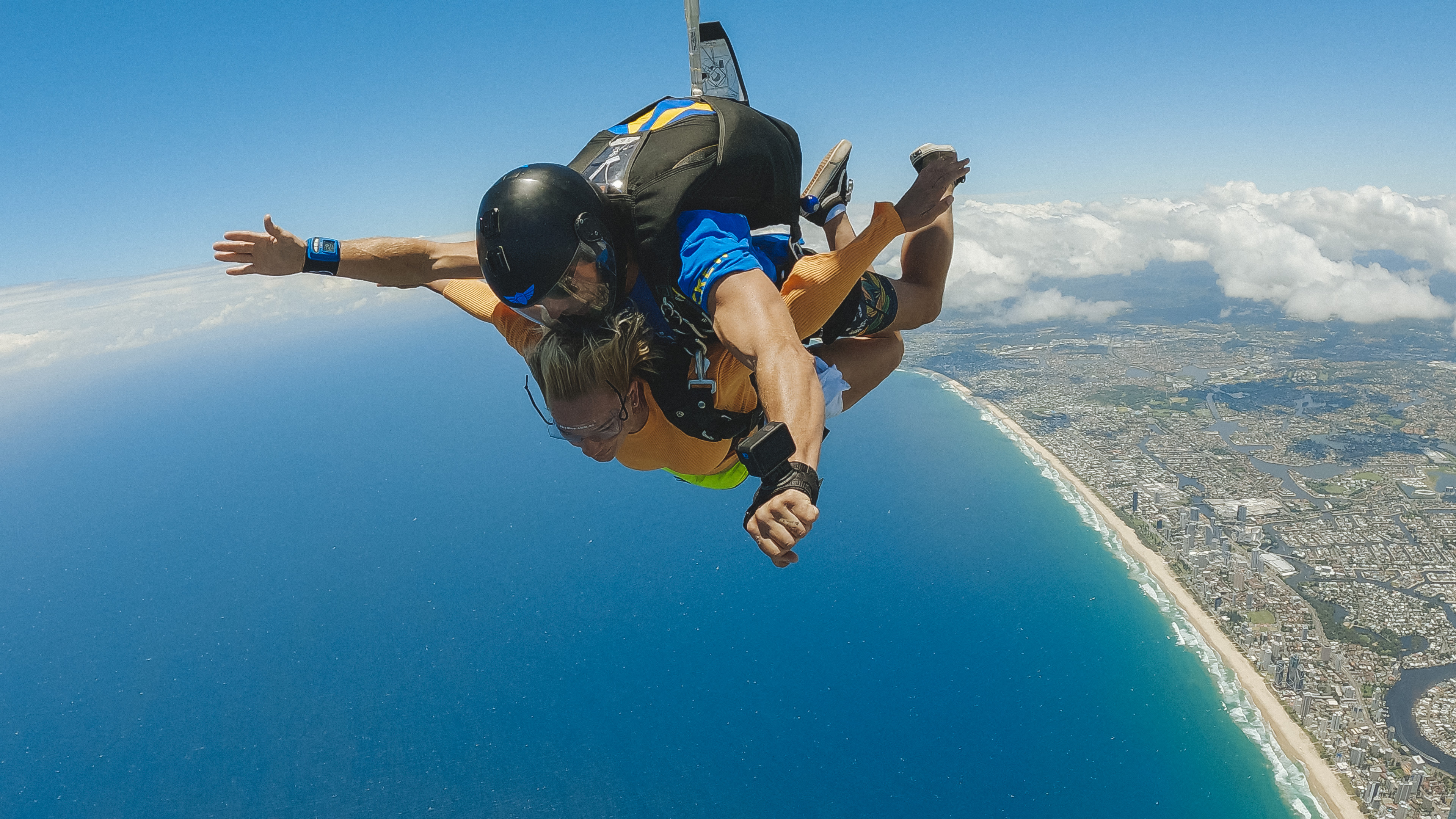 Lady doing a tandem skydive above the Gold Coast Lady doing a tandem skydive above the Gold Coast