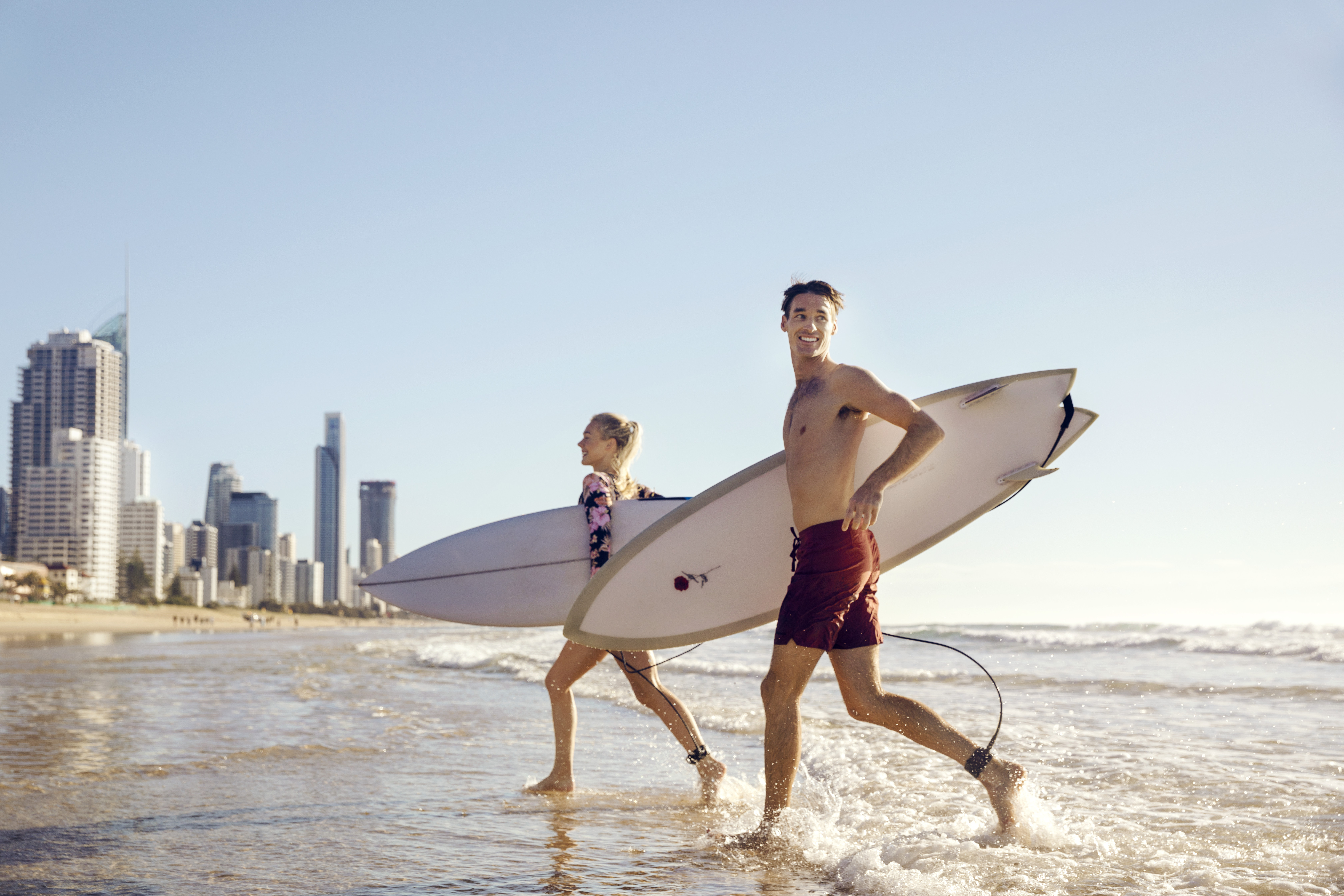 Couple on the beach with their Surfboards