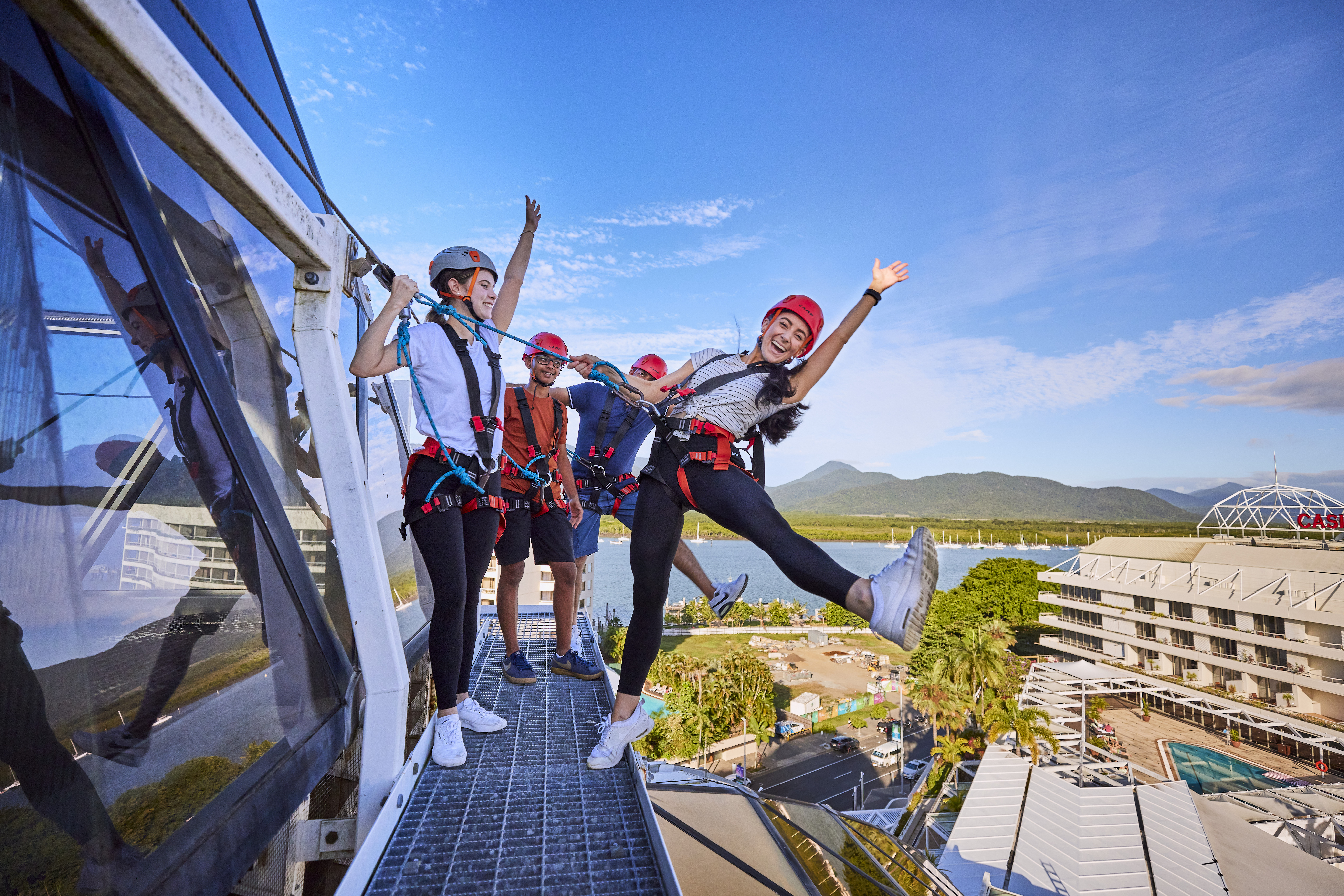 Group having fun on the Wildlife Dome-Climb overlooking Cairns City Group having fun on the Wildlife Dome-Climb overlooking Cairns City