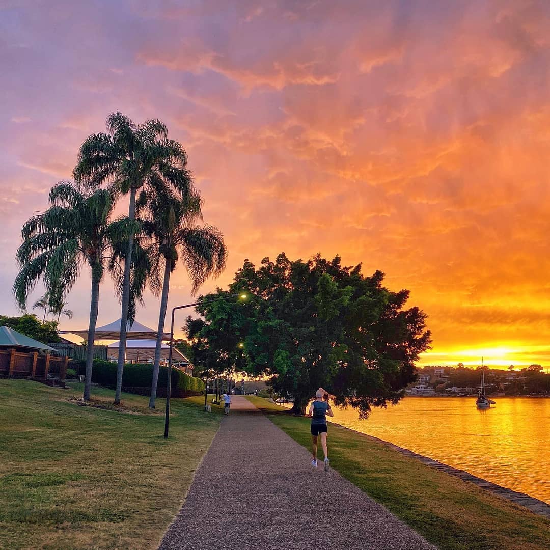 Running by Brisbane River | first marathon training tips