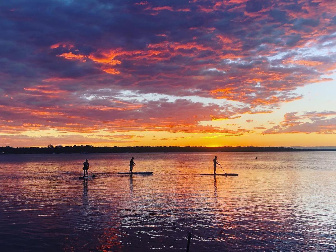 Stand up paddleboarding at sunset on Bribie Island Stand up paddleboarding at sunset on Bribie Island