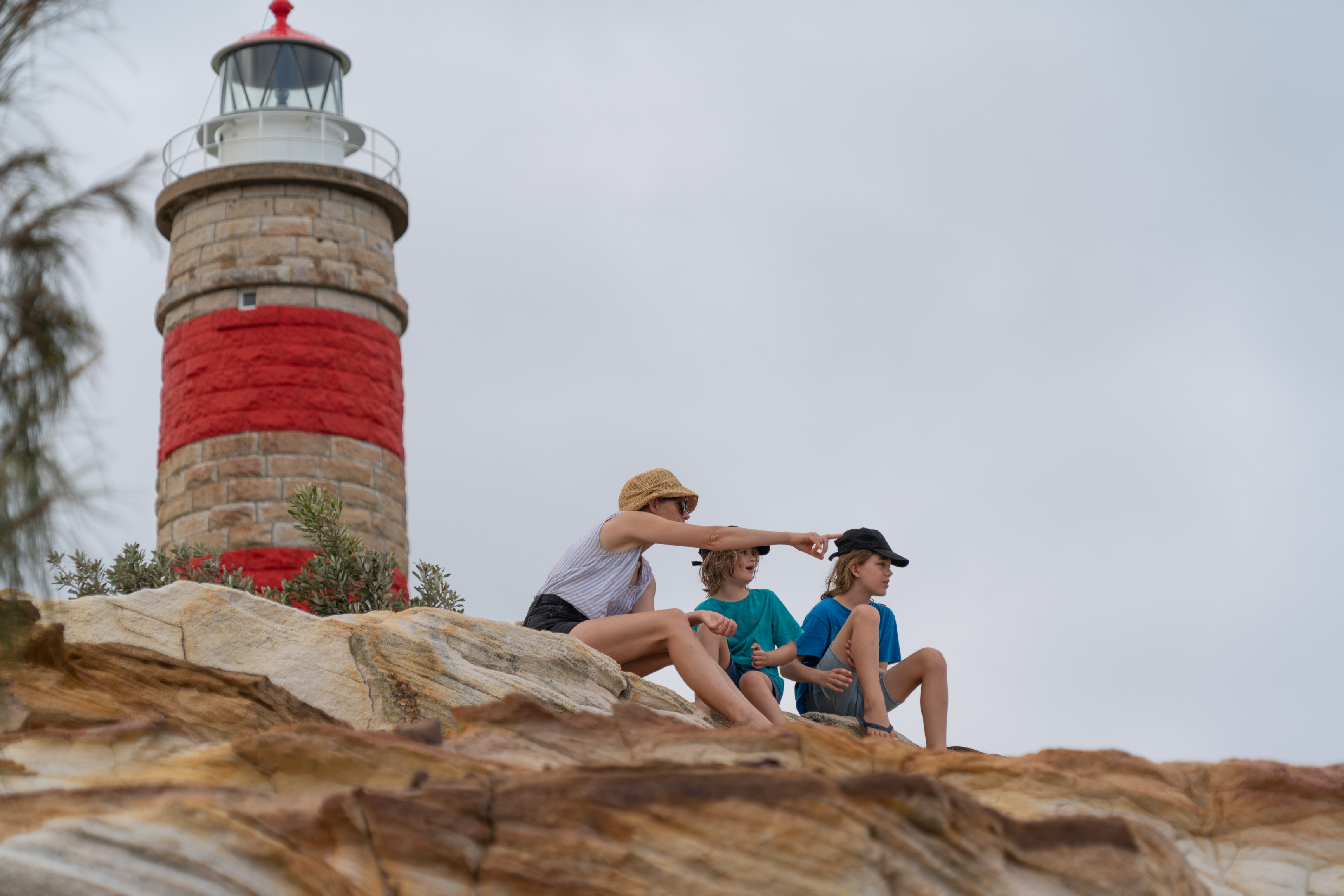 Family look out at ocean from Cape Moreton Lighthouse, Moreton Island