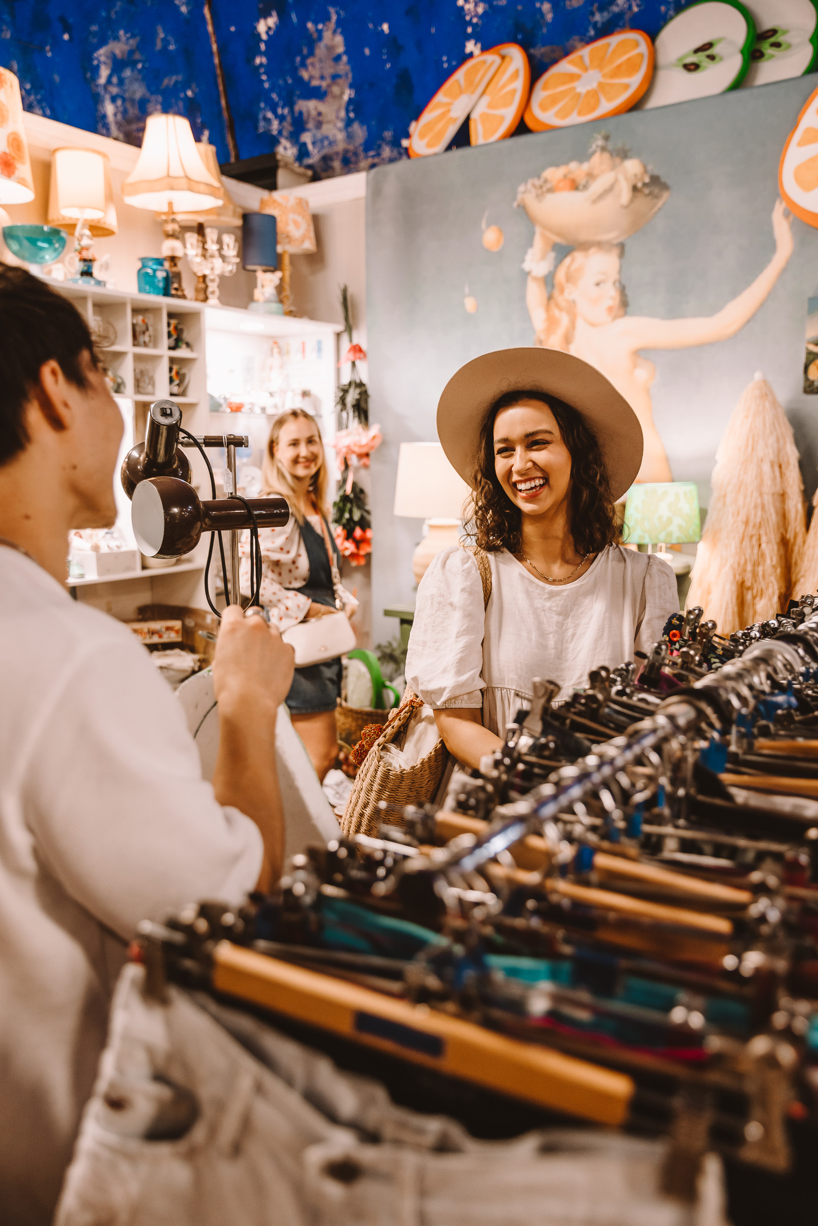 Friends shopping for second hand/vintage clothes at Empire Revival Paddington