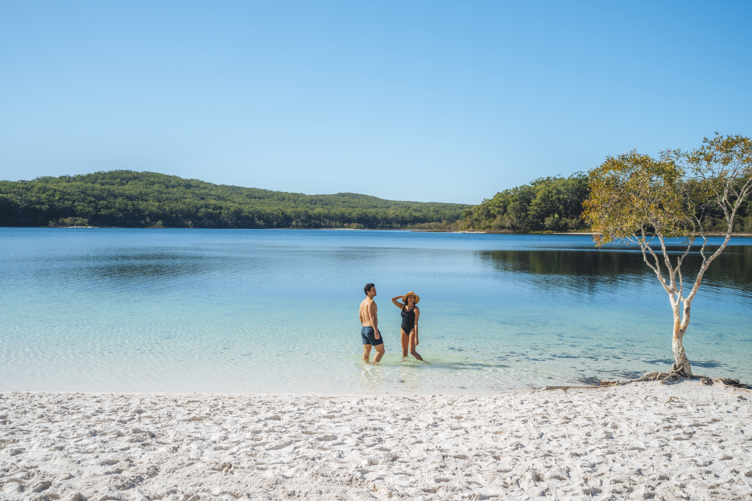 Couple relaxing in the water at Lake McKenzie