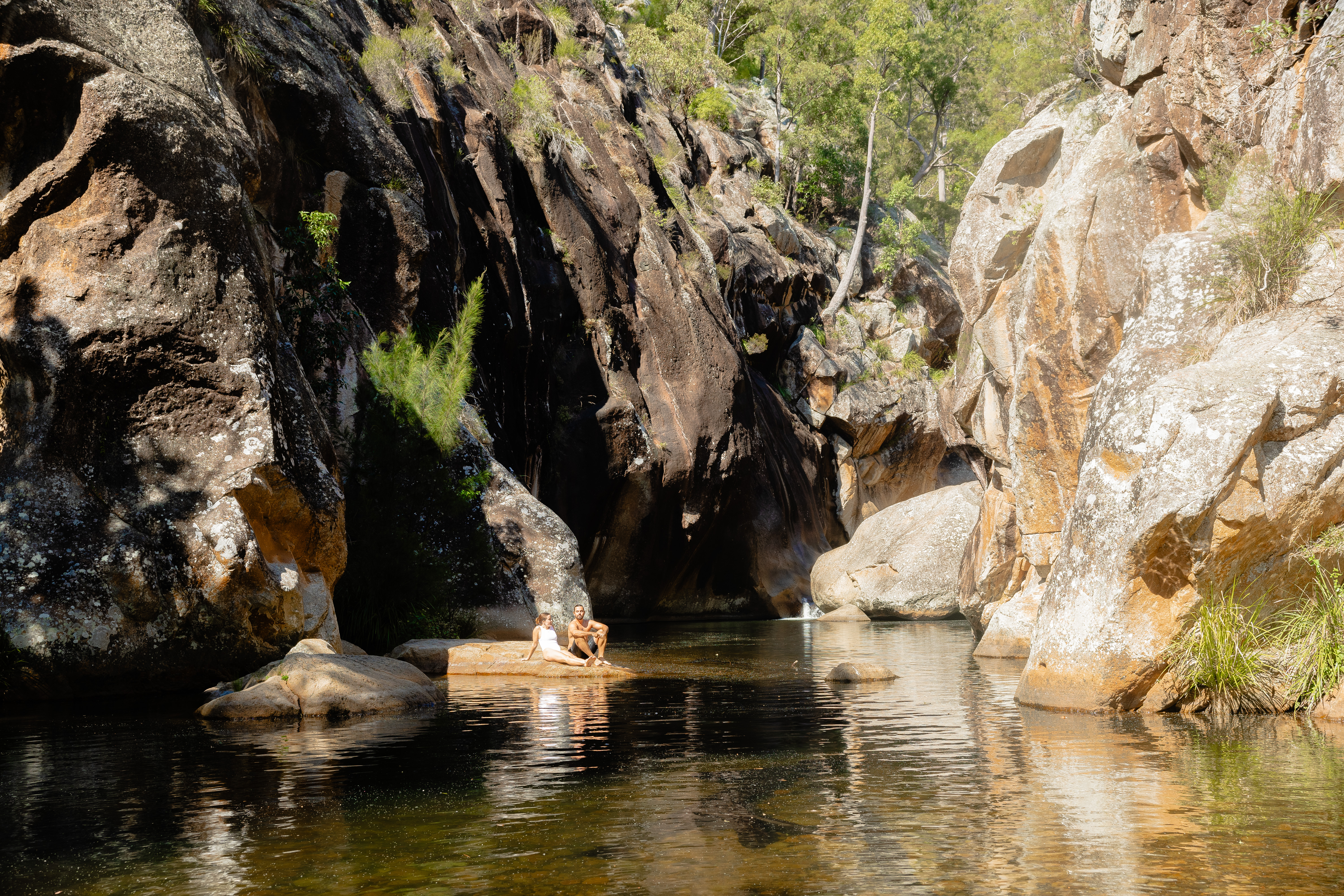 Couple swimming at waterhole