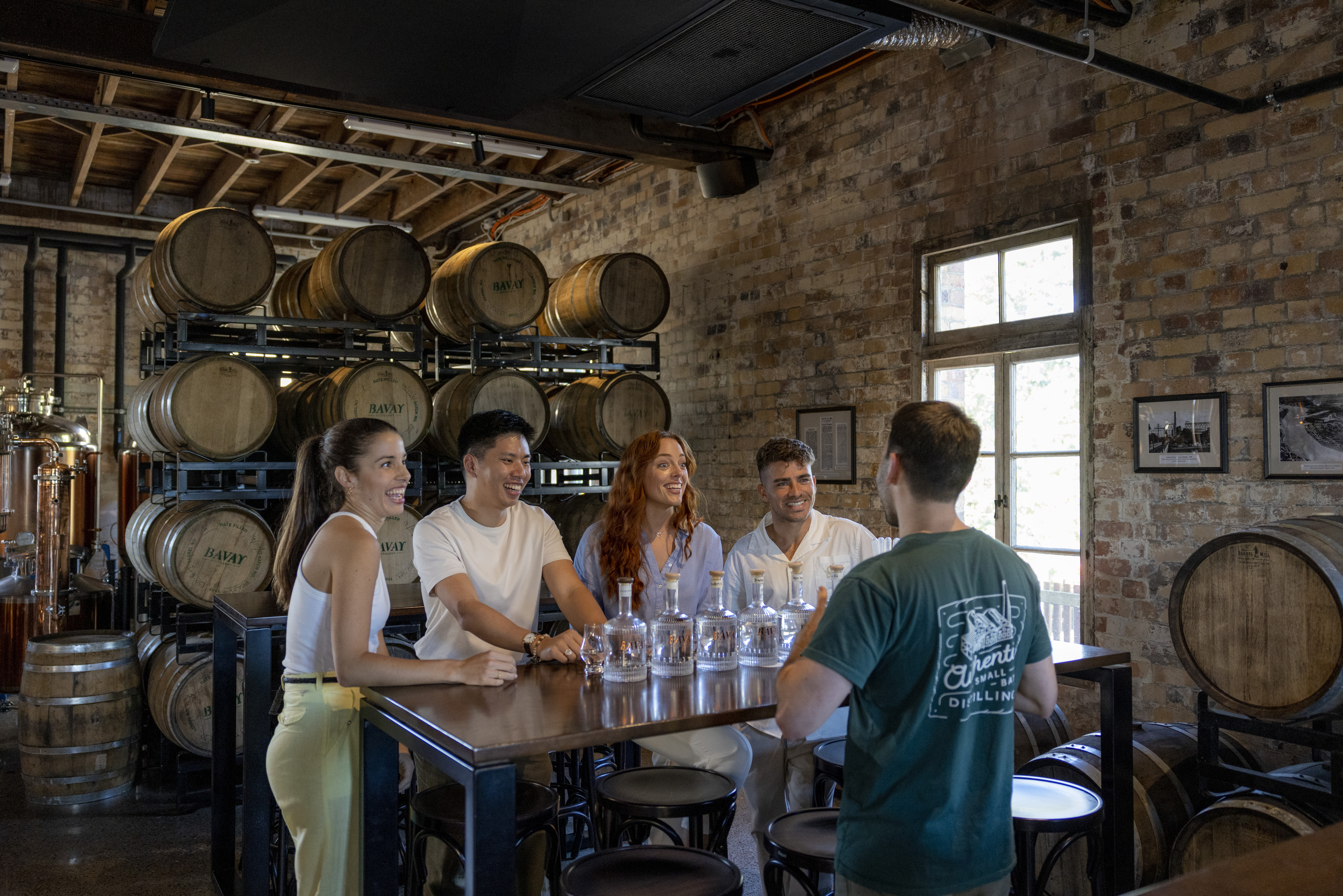 A group of people learn to make gin at a distillery at Rivermakers A group of people learn to make gin at a distillery at Rivermakers