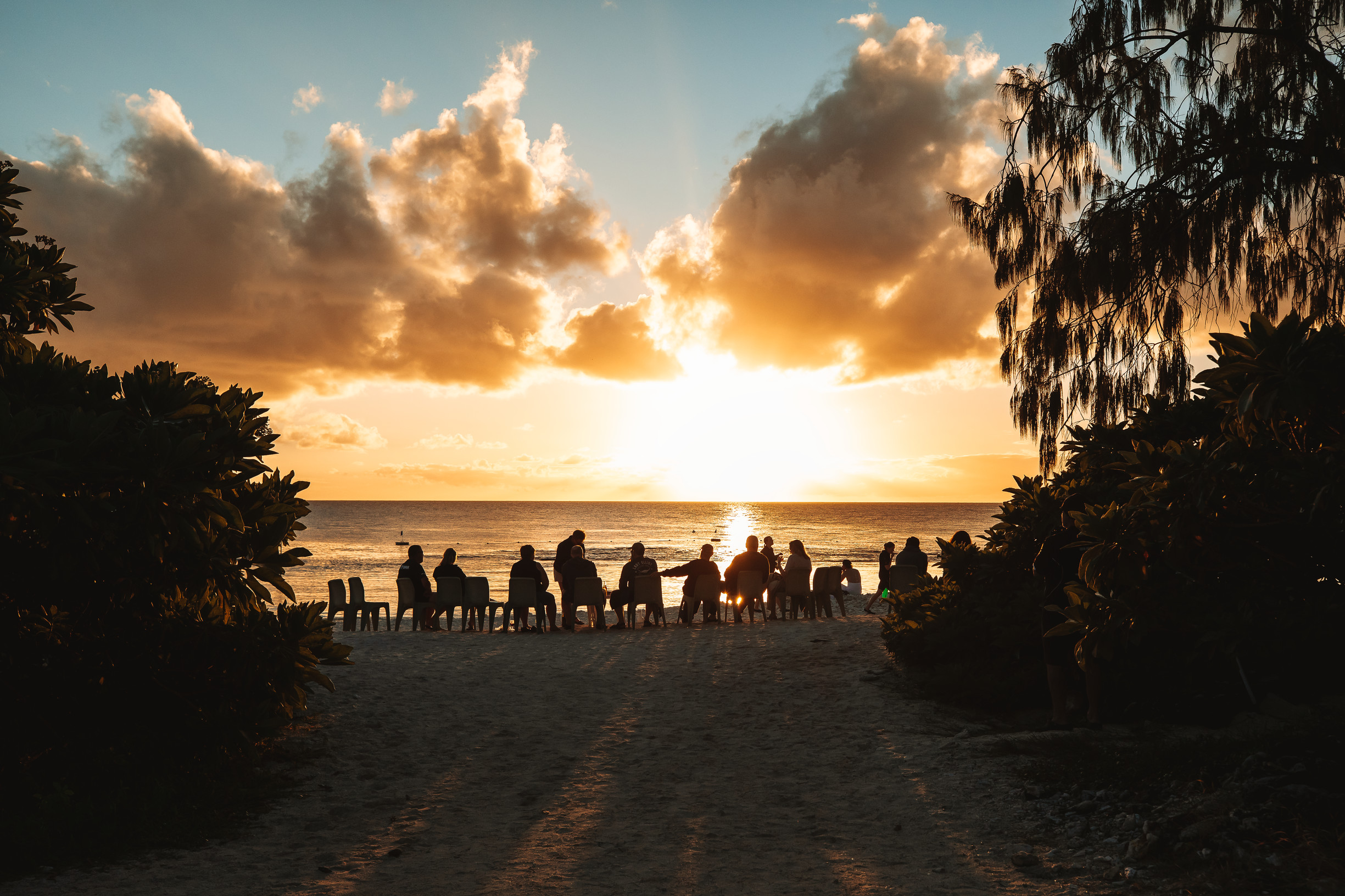 Group of people watching the sun set over Lady Elliot Island | Family road trip to see turtles Bundaberg Group of people watching the sun set over Lady Elliot Island | Family road trip to see turtles Bundaberg
