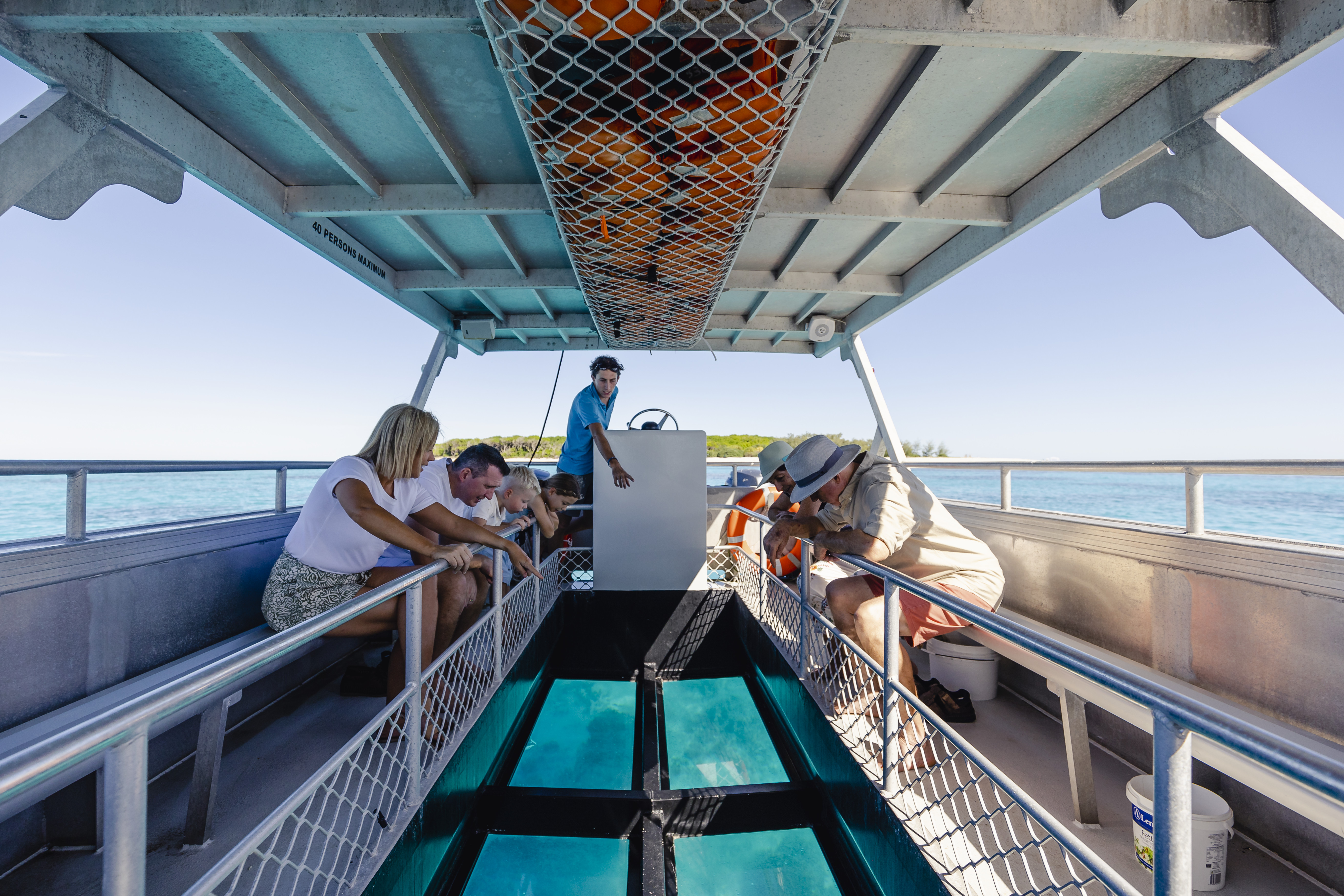 Guests on a glass bottom boat ride with Lady Musgrave Experience HQ, the eco-certified pontoon on the Southern Great Barrier Reef offering day trips and luxury overnight glamping stays Guests on a glass bottom boat ride with Lady Musgrave Experience HQ, the eco-certified pontoon on the Southern Great Barrier Reef offering day trips and luxury overnight glamping stays
