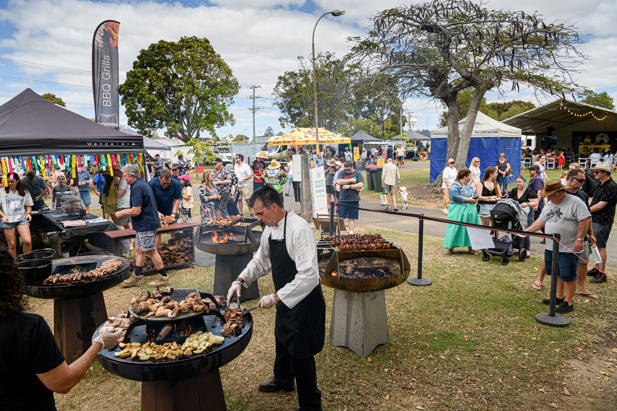 Chefs cook over flames outdoors at Taste Bundaberg food festival Chefs cook over flames outdoors at Taste Bundaberg food festival