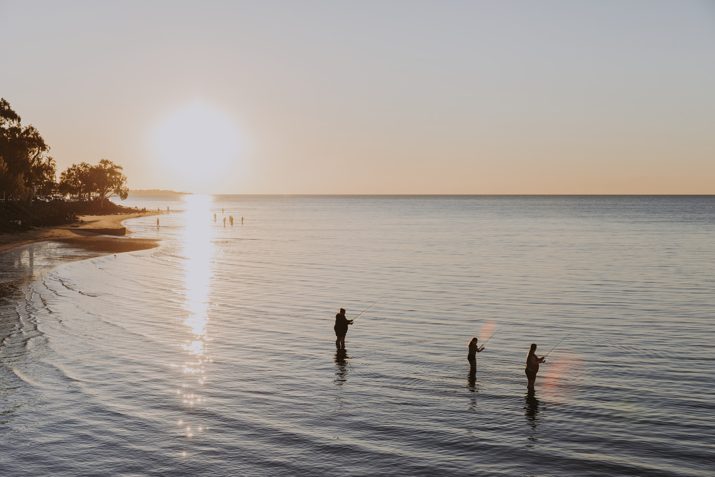 People fishing at sunset The Esplanade Hervey bay People fishing at sunset The Esplanade Hervey bay