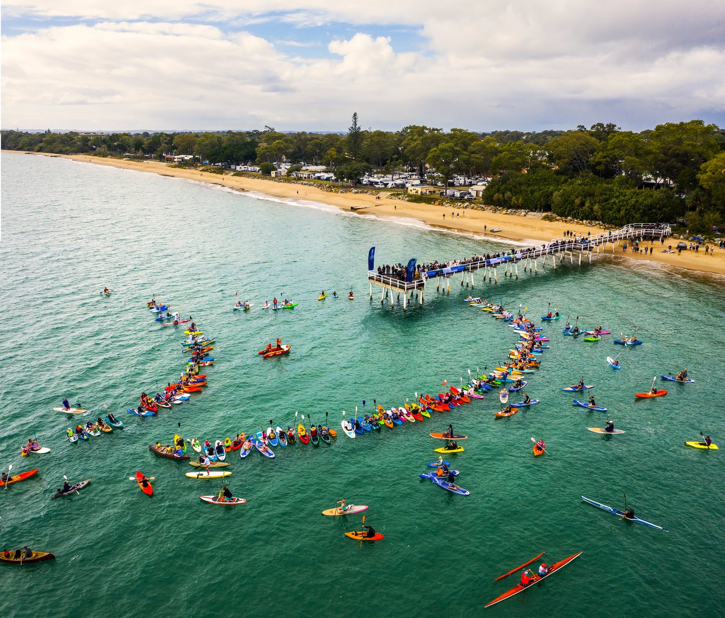 Community 'paddle out for whales' event during Hervey Bay Whale Festival Community 'paddle out for whales' event during Hervey Bay Whale Festival
