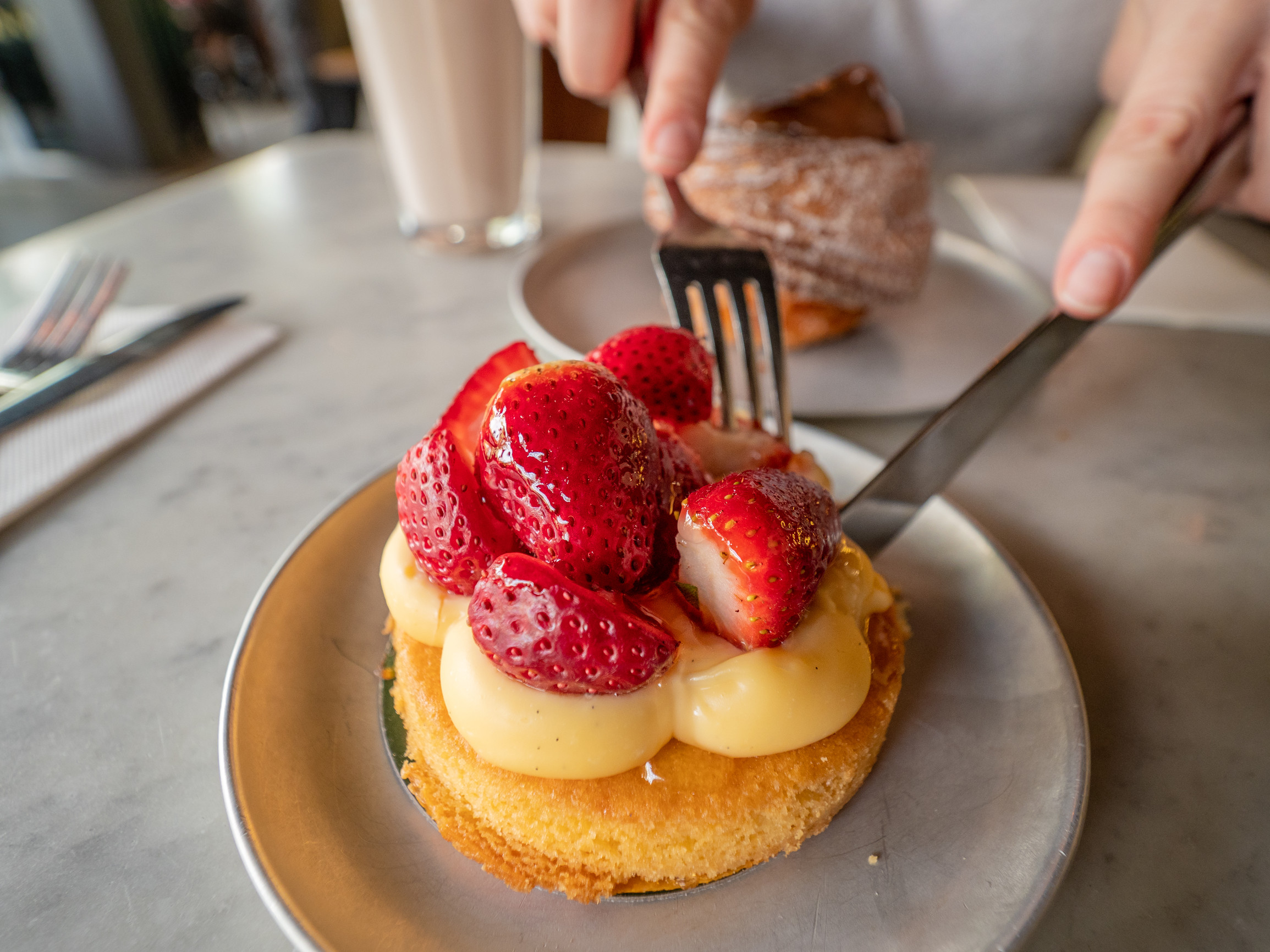 Cutting into a strawberry tart at Bam Bam Bakehouse