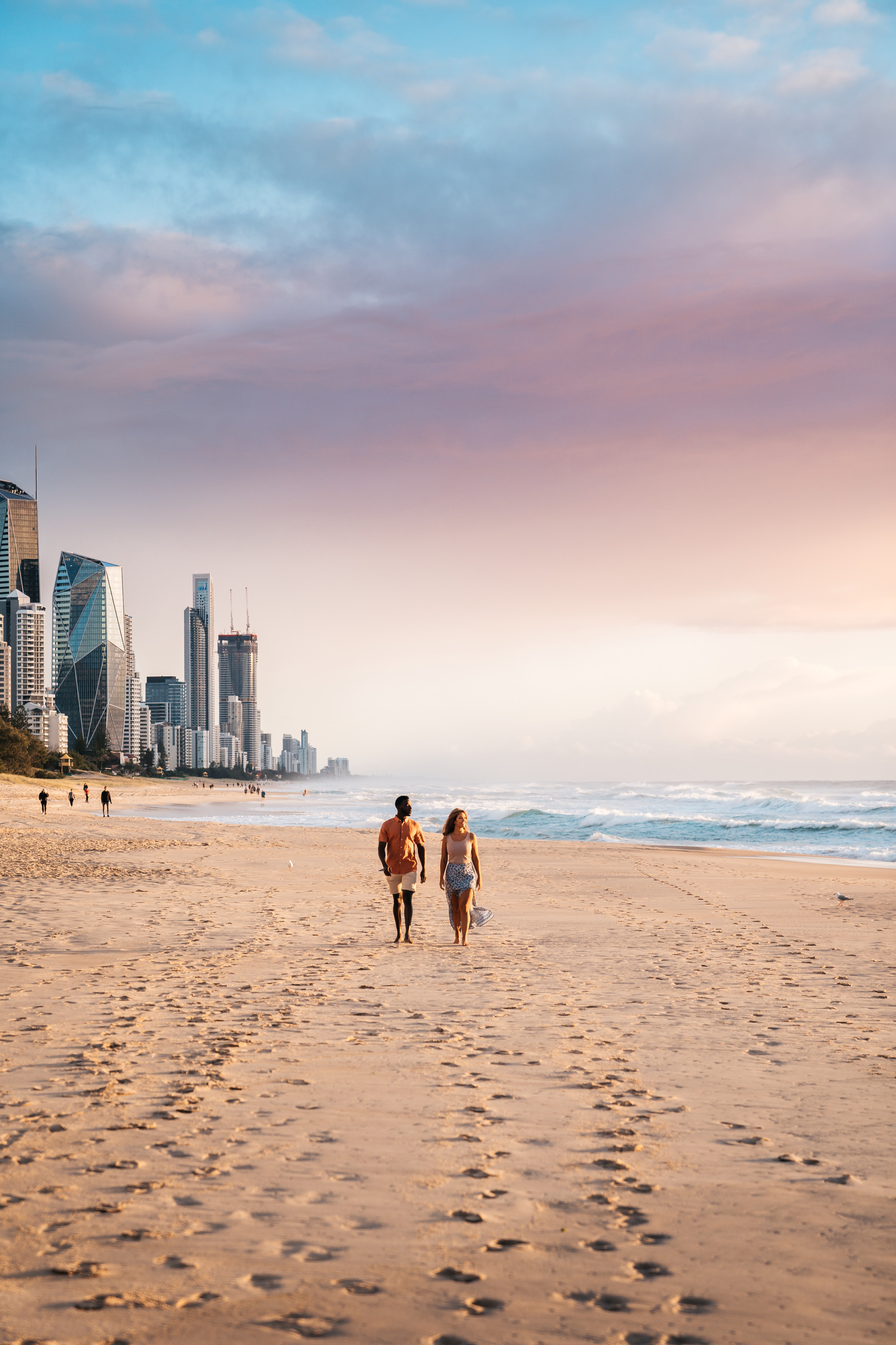 Couple Walking Along Beach at Broadbeach | Where to spot celebrities Gold Coast Couple Walking Along Beach at Broadbeach | Where to spot celebrities Gold Coast