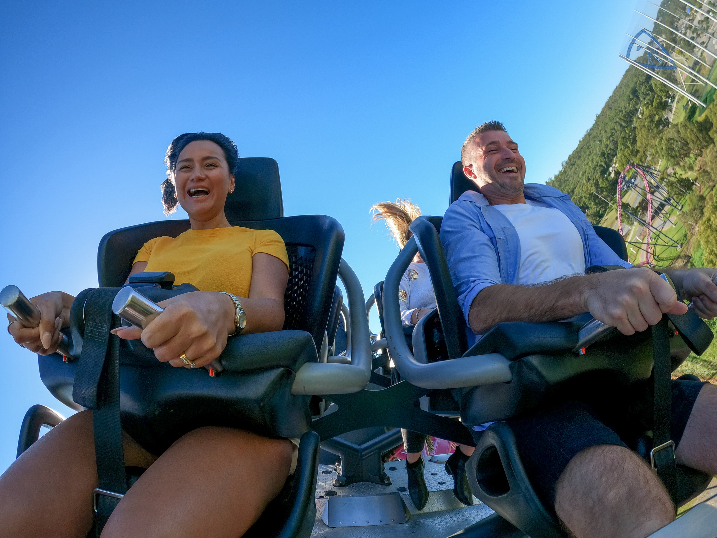 A couple on a rollercoaster at Warner Bros. Movie World on the Gold Coast
