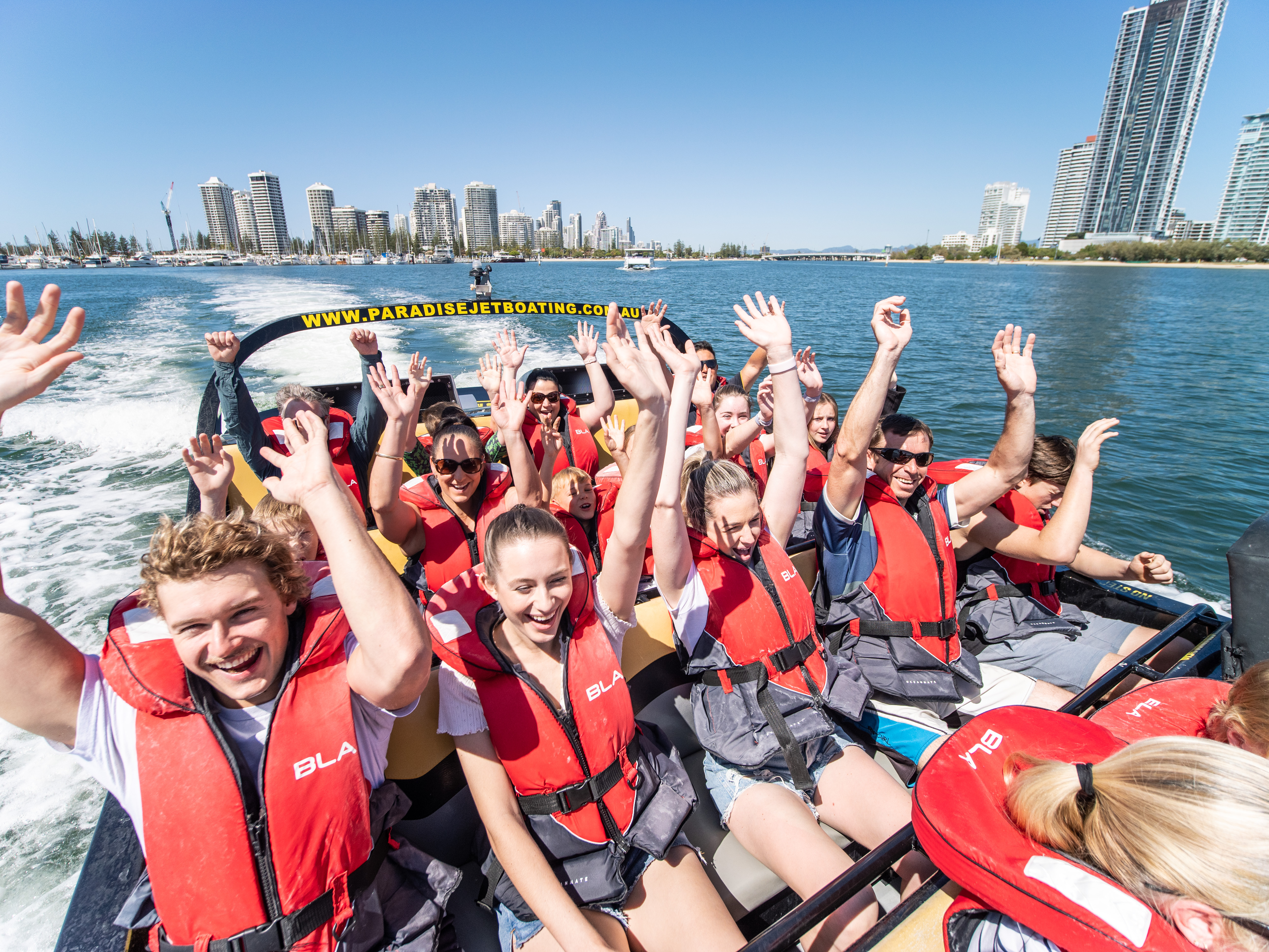 Guests enjoying the Jet Boat Adventure Ride on the Broadwater