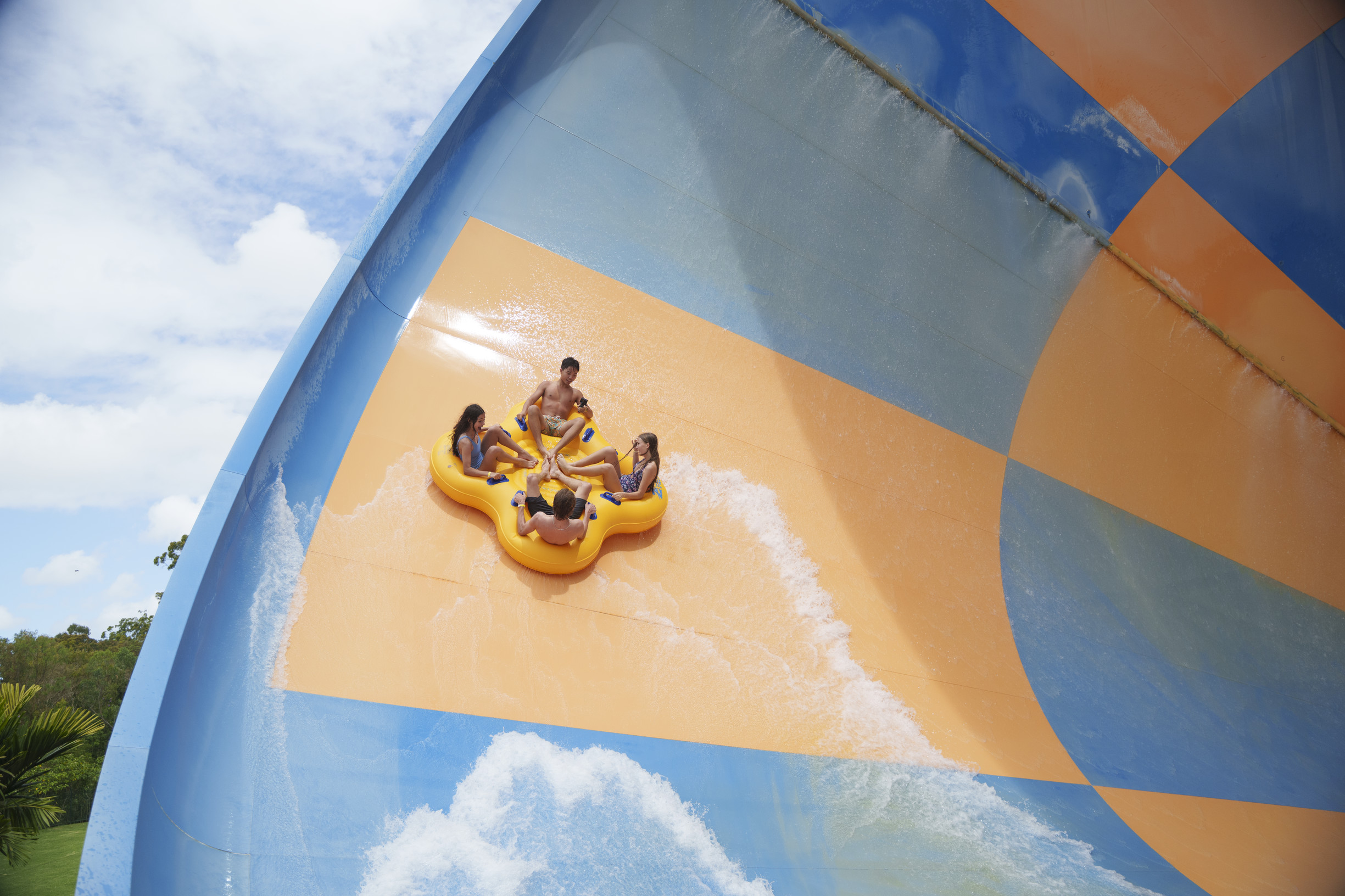 Family on a water slide at Wet 'n' Wild Gold Coast Family on a water slide at Wet 'n' Wild Gold Coast