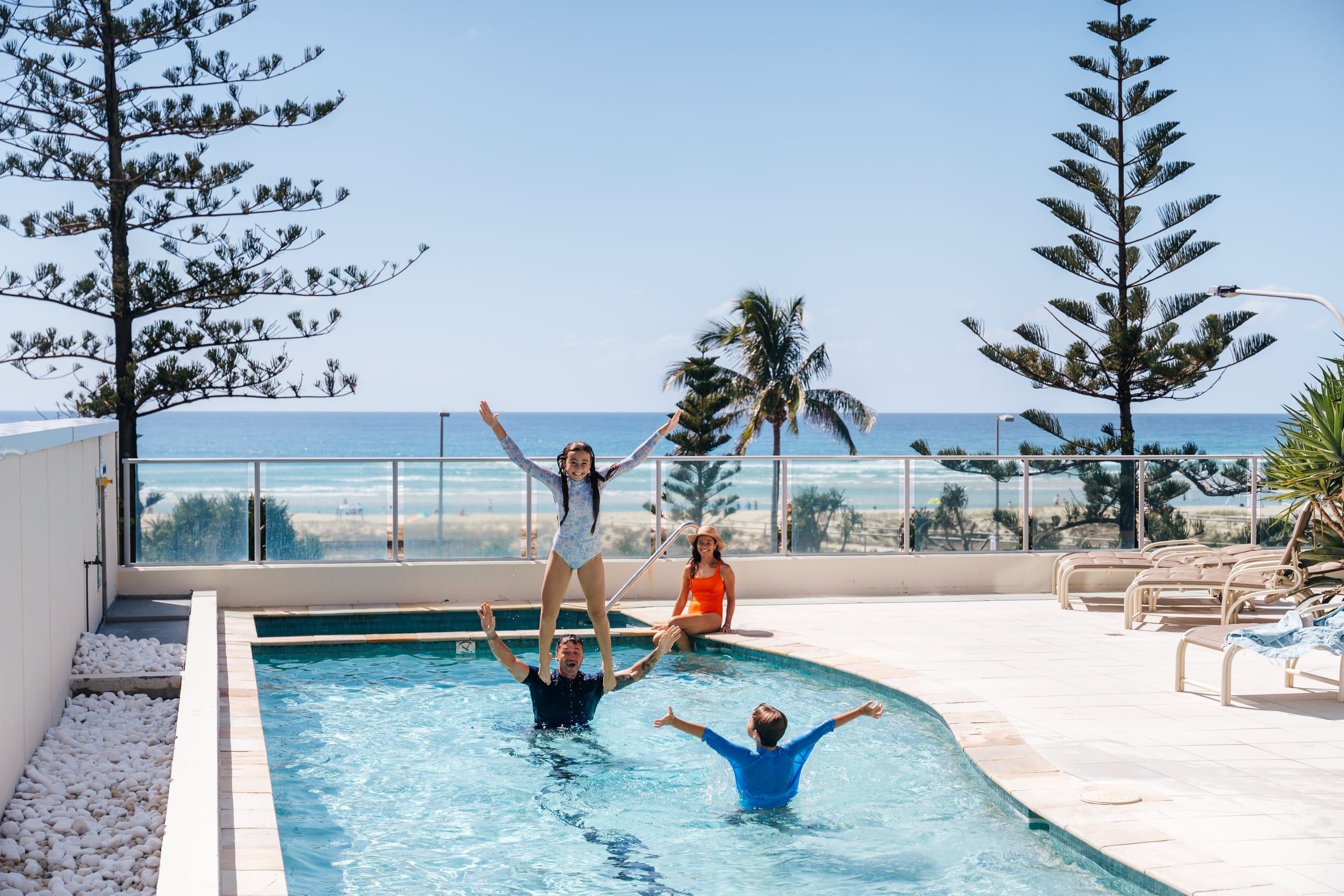 Family playing in the pool at apartment complex Reflections Coolangatta Beach