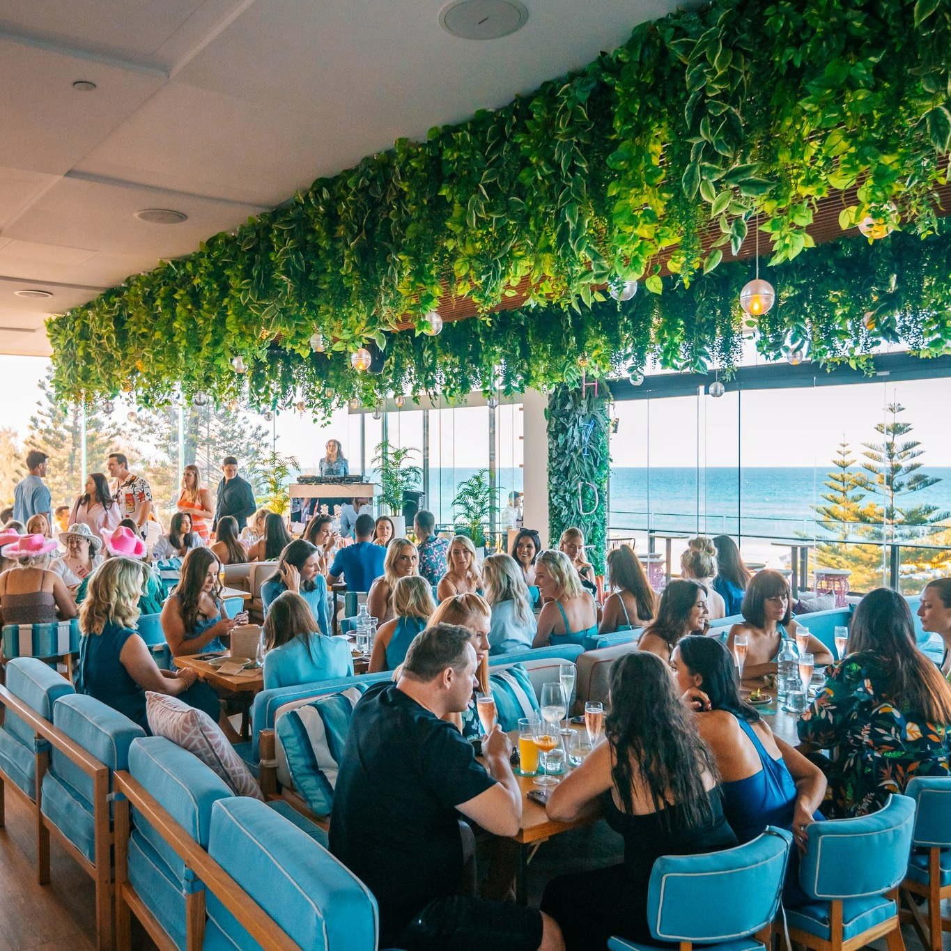 Tables of diners sit among leafy surrounds and ocean views at Hyde Paradiso, Surfers Paradise Tables of diners sit among leafy surrounds and ocean views at Hyde Paradiso, Surfers Paradise