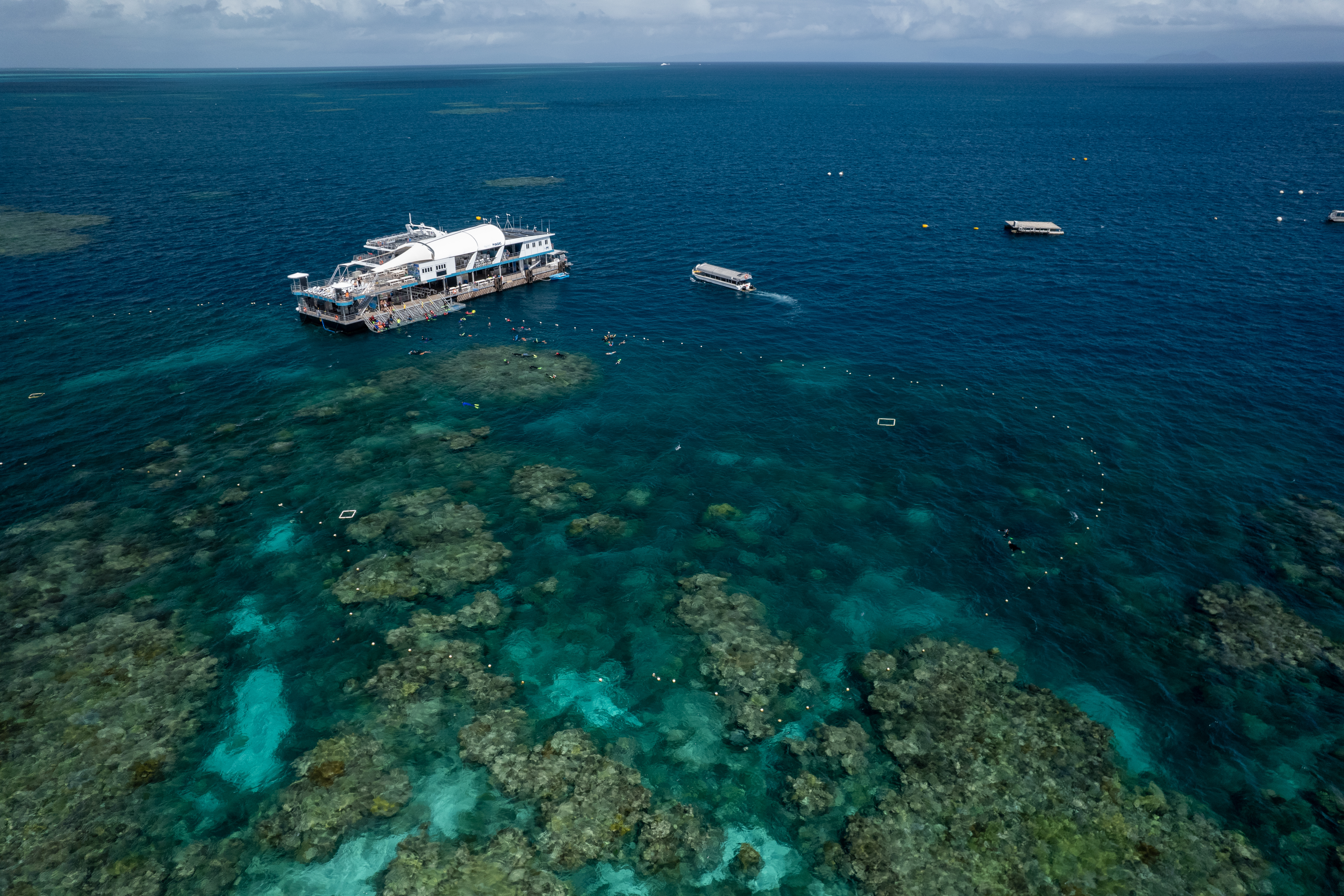 Aerial of the Reef Magic pontoon, Remora, on Moore Reef.