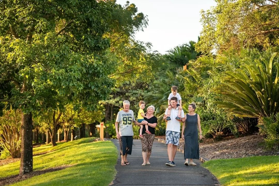 Multi-generational family walk the paths through Mackay Botanic Gardens Multi-generational family walk the paths through Mackay Botanic Gardens