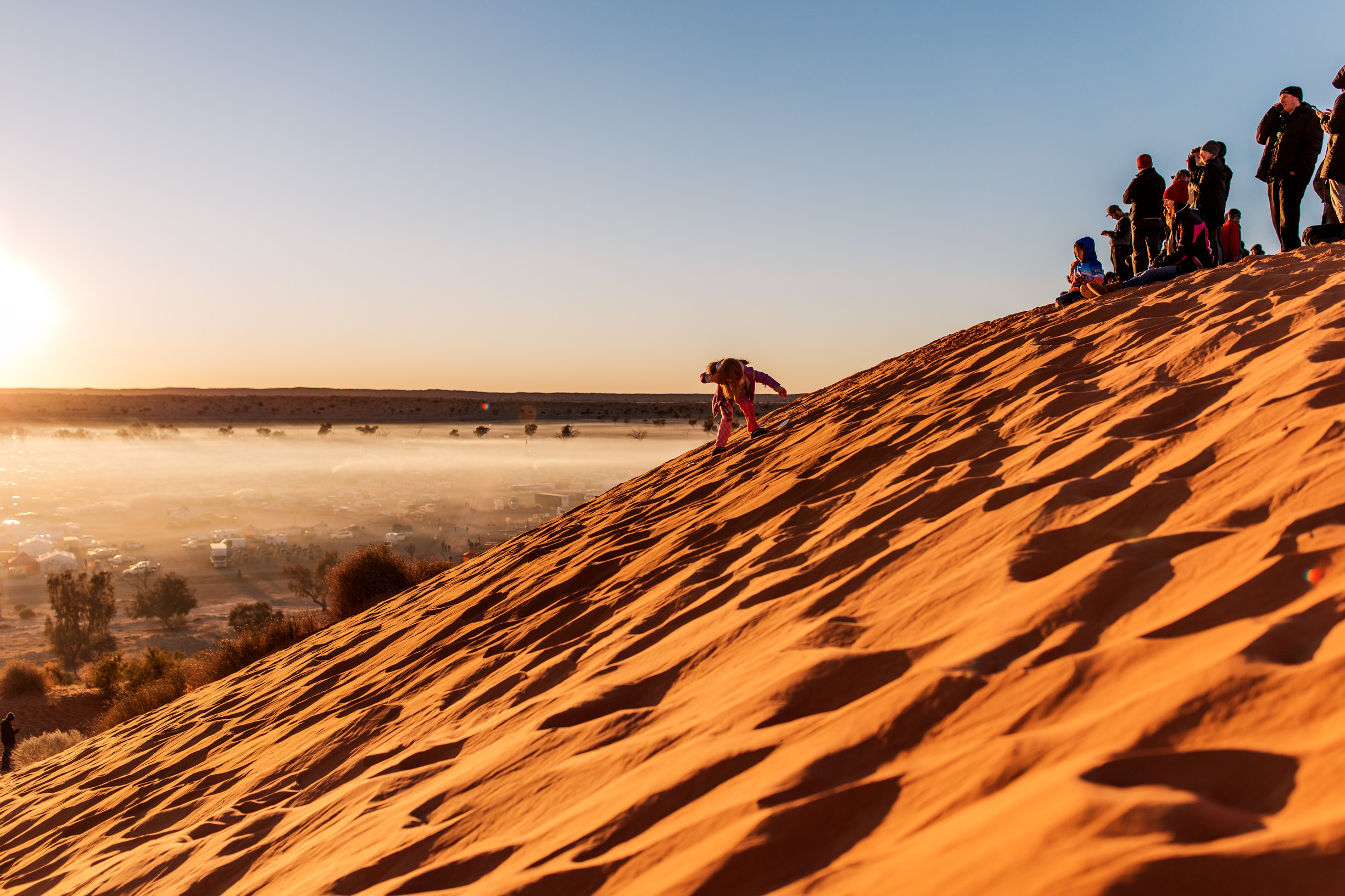 Sand dune surfing at Birdsville Big Red Bash, Outback Queensland