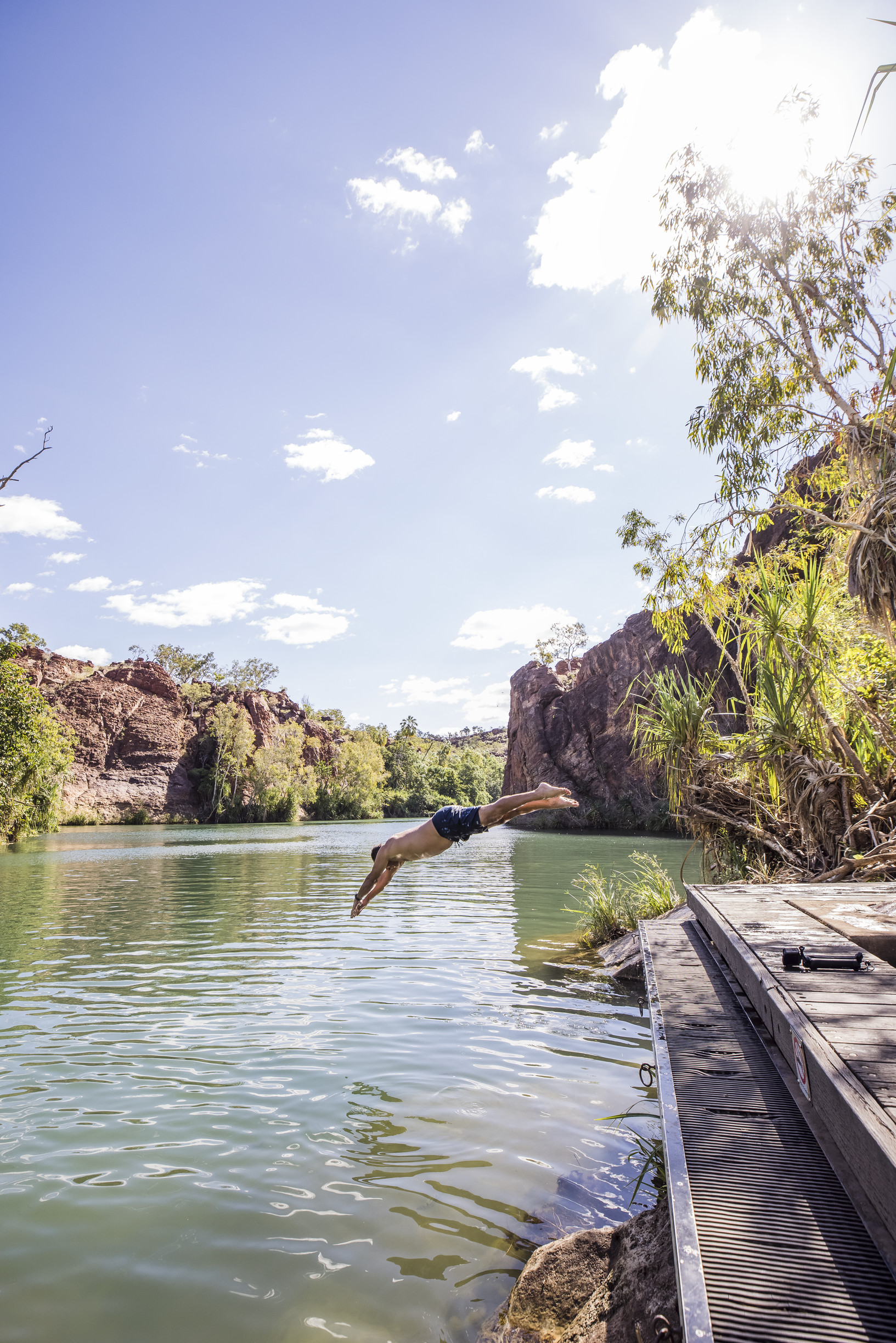 Man diving in to the water at Boodjamulla (Lawn Hill) National Park Man diving in to the water at Boodjamulla (Lawn Hill) National Park