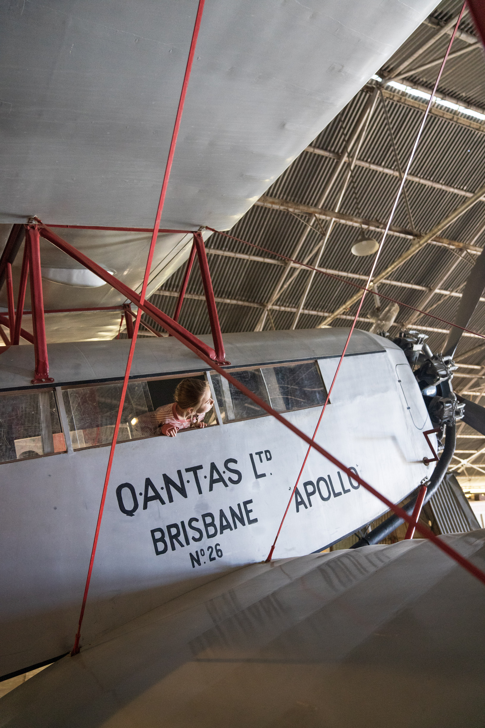 Child inside historic plane at Qantas Founders Museum | four day longreach itinerary families Child inside historic plane at Qantas Founders Museum | four day longreach itinerary families