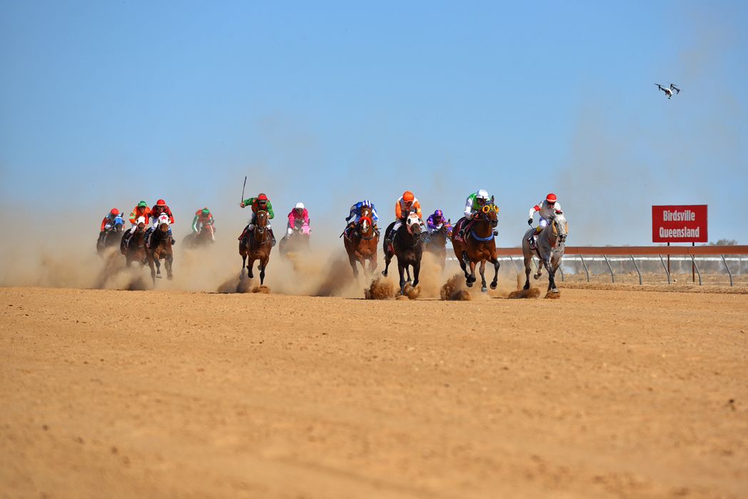 Jockeys riding their horses at the Birdsville Races