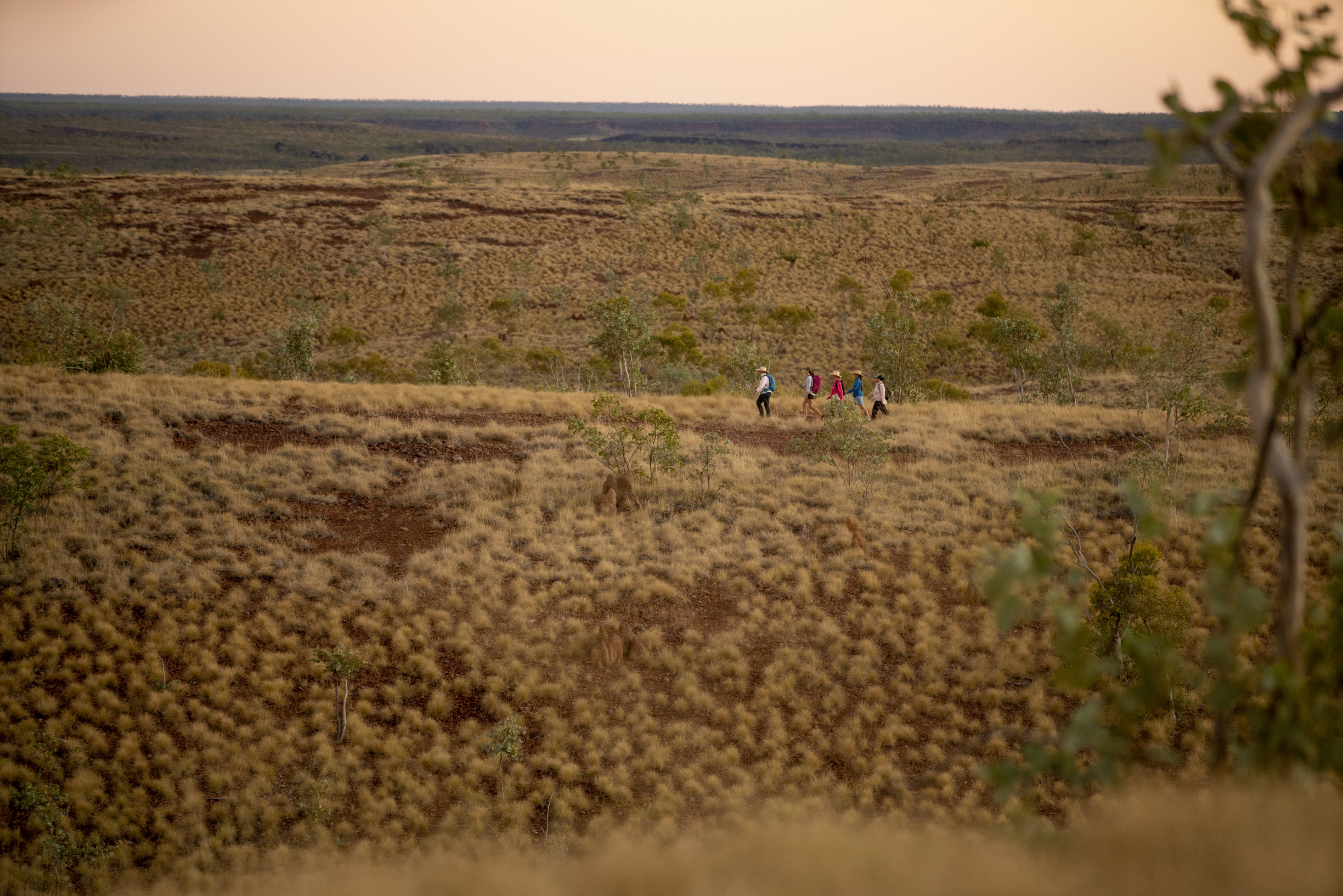 Group hiking through the ruggered landscape Group hiking through the ruggered landscape