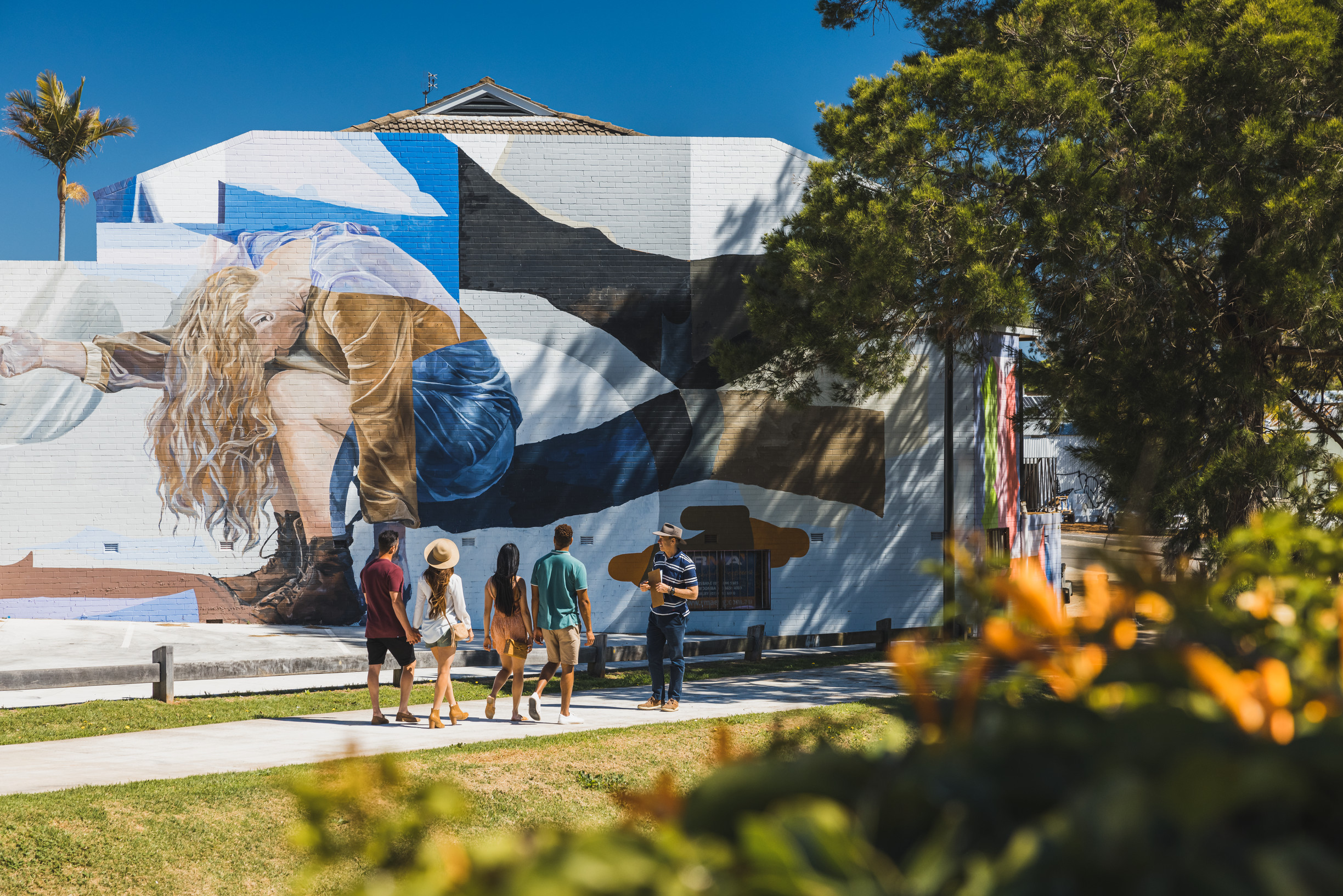 Group of friends looking at street art around Toowoomba | family caravan holiday toowoomba Group of friends looking at street art around Toowoomba | family caravan holiday toowoomba