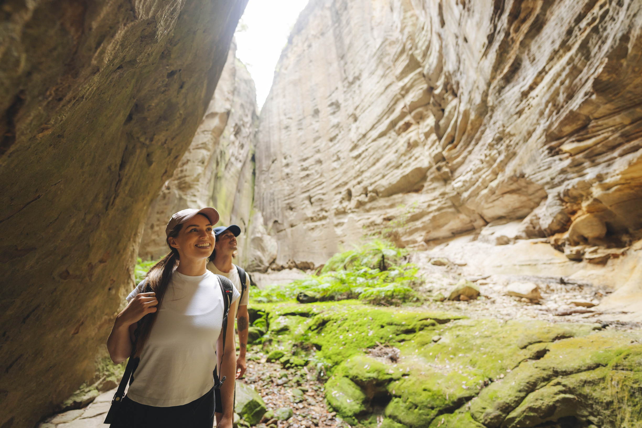 Two hikers exploring the natural landscape of the Ampitheatre Walk
