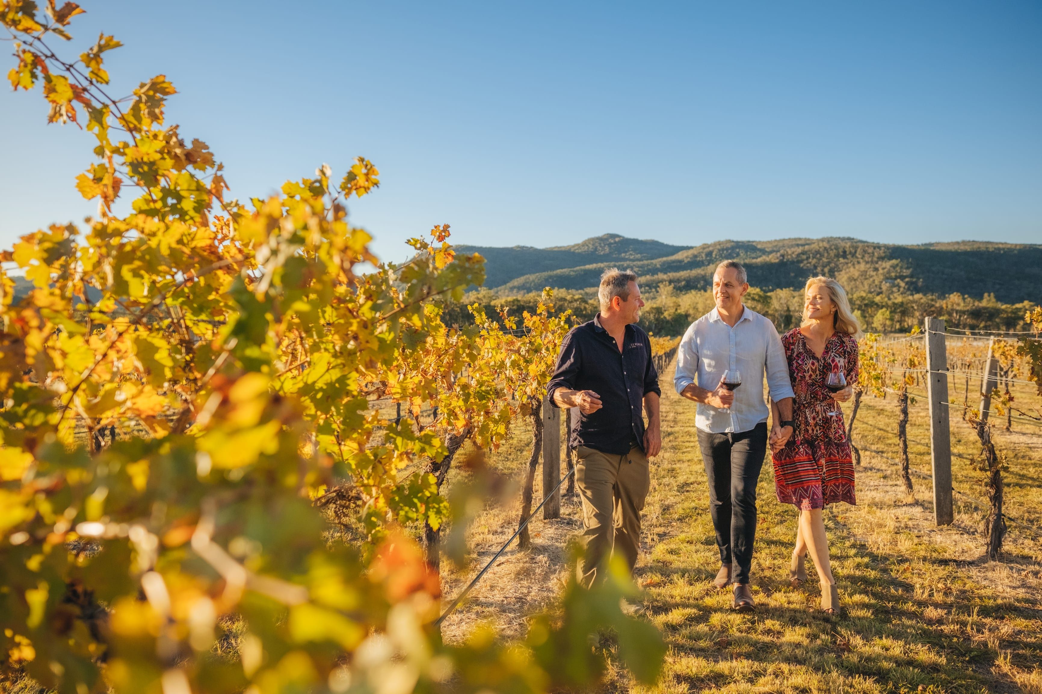 Couple walking through Seventh Wines vineyards and tasting the local wine | big sky country