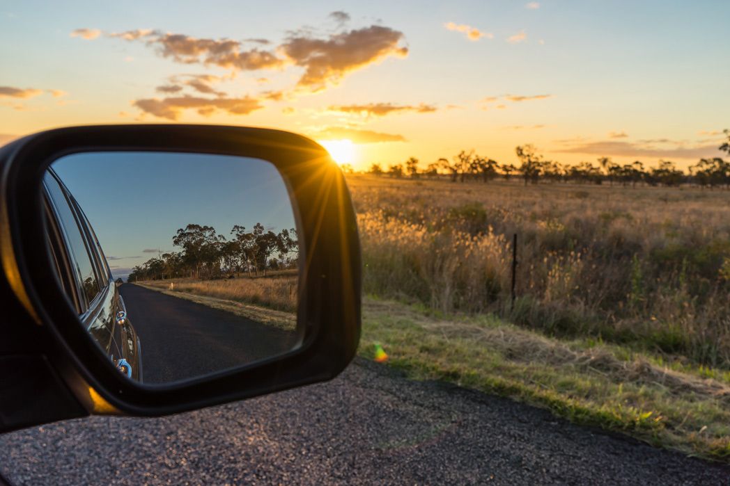 Car driving on road at sunset Car driving on road at sunset