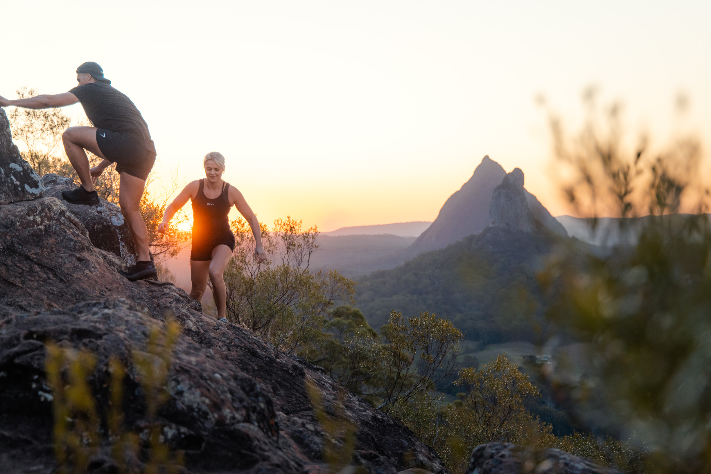 Couple hiking to the summit Mount Ngungun Sunshine Coast Glass House Mountains | wellness holiday Sunshine Coast Couple hiking to the summit Mount Ngungun Sunshine Coast Glass House Mountains | wellness holiday Sunshine Coast