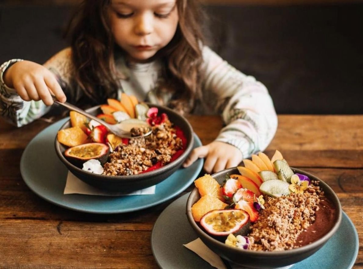A young girl enjoying breakfast at CK Coffee Bar Maroochydore