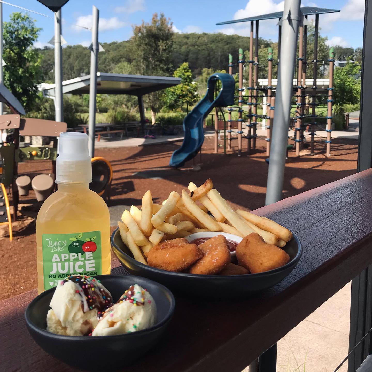 Apple juice and chips and chicken nuggets at Park & Co, Bli Bli 