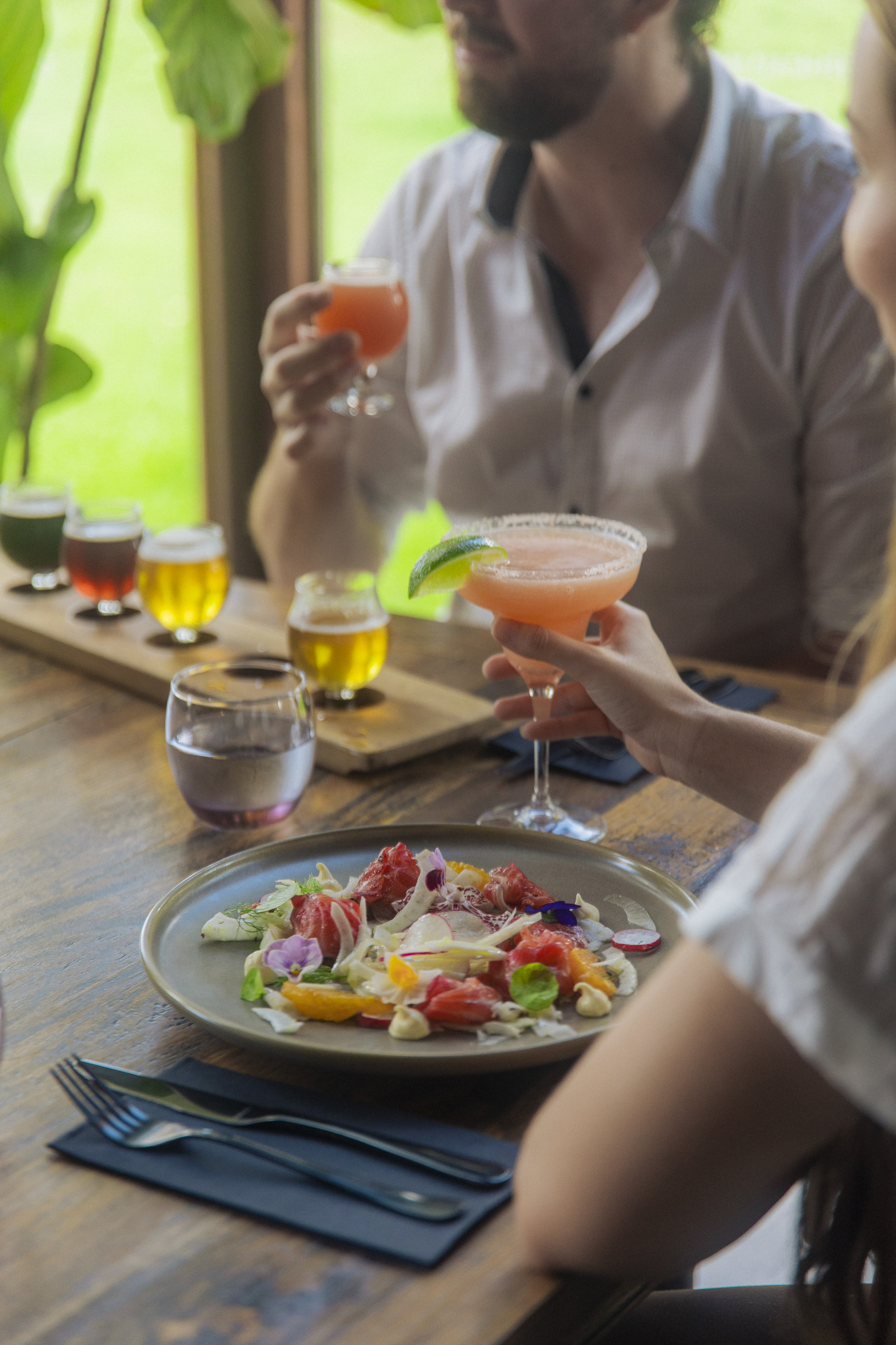 Couple enjoying a meal and drink at Copperhead Restaurant Brewery