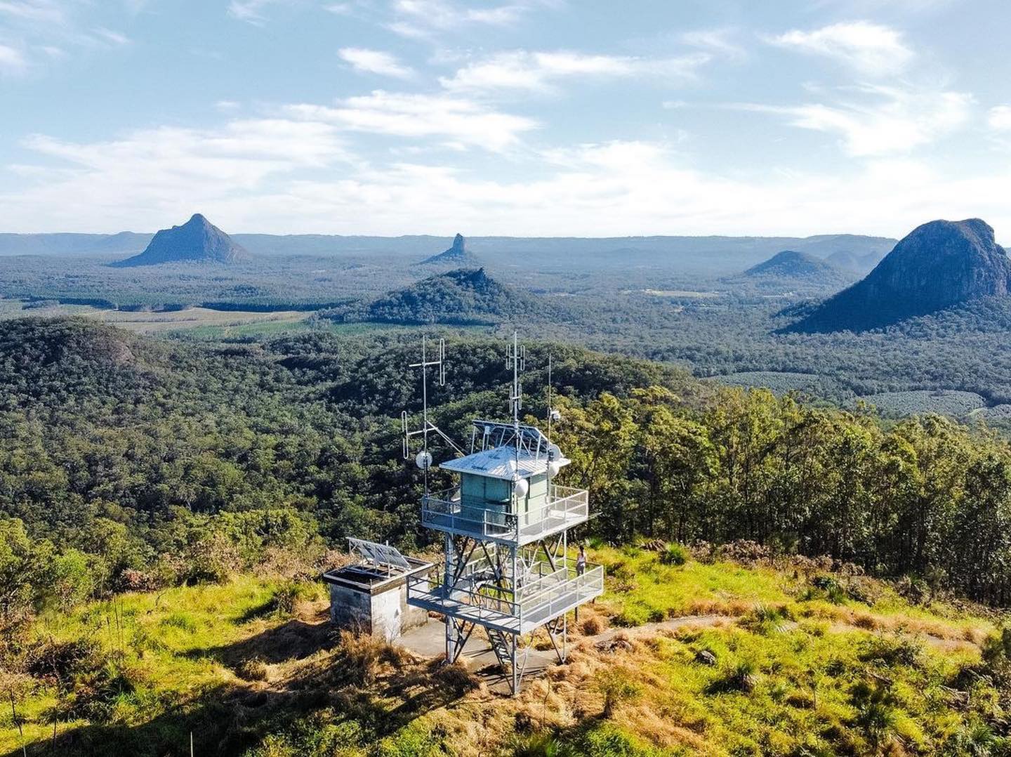 Aerial view of a fire tower lookout overlooking mountain range