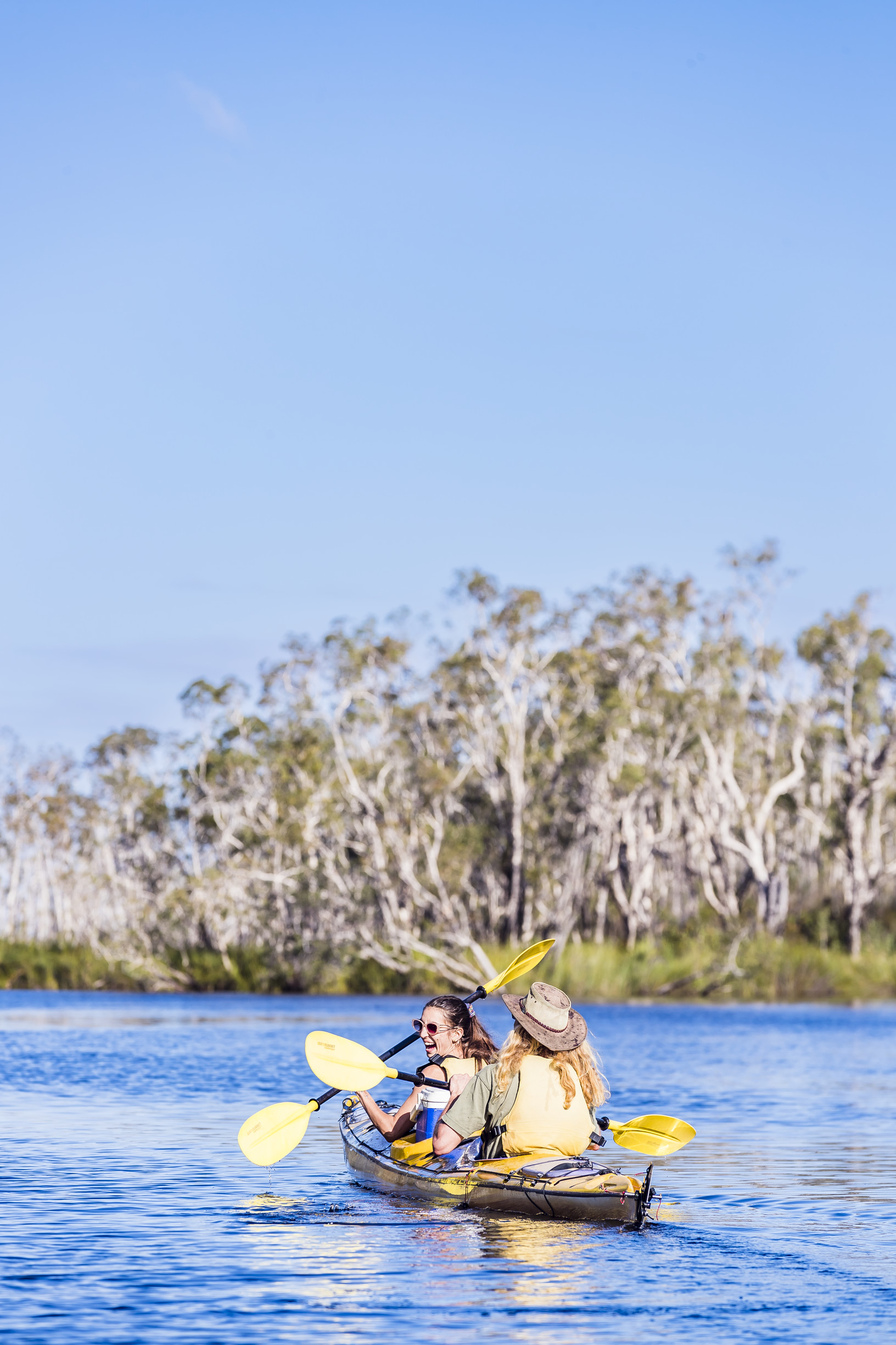 Two women on a guided kayak tour through the Noosa Everglades with Kanu Kapers Australia