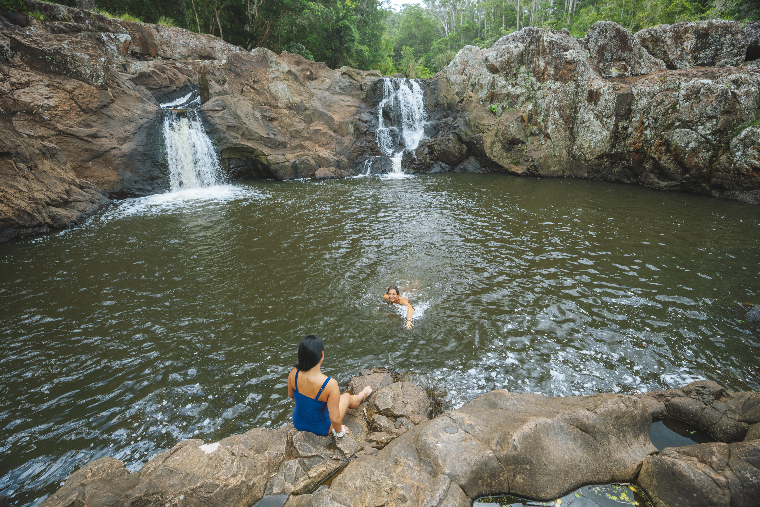 Couple having a swim the the rock pool at Wappa Falls Couple having a swim the the rock pool at Wappa Falls