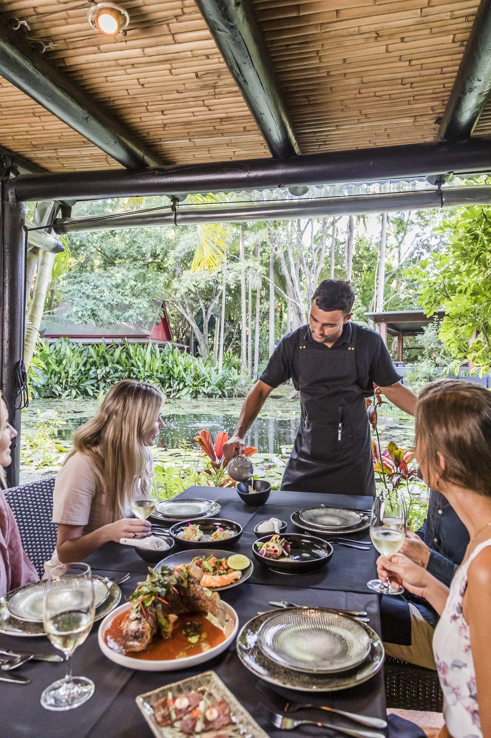 Group dining at Spirit House Yandina, an Asian-inspired restaurant set among lush rainforest gardens