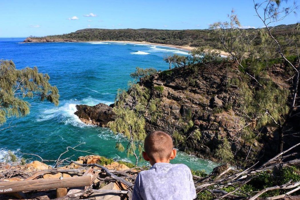 A male child overlooking Noosa National Park | Budget Sunshine Coast holiday A male child overlooking Noosa National Park | Budget Sunshine Coast holiday