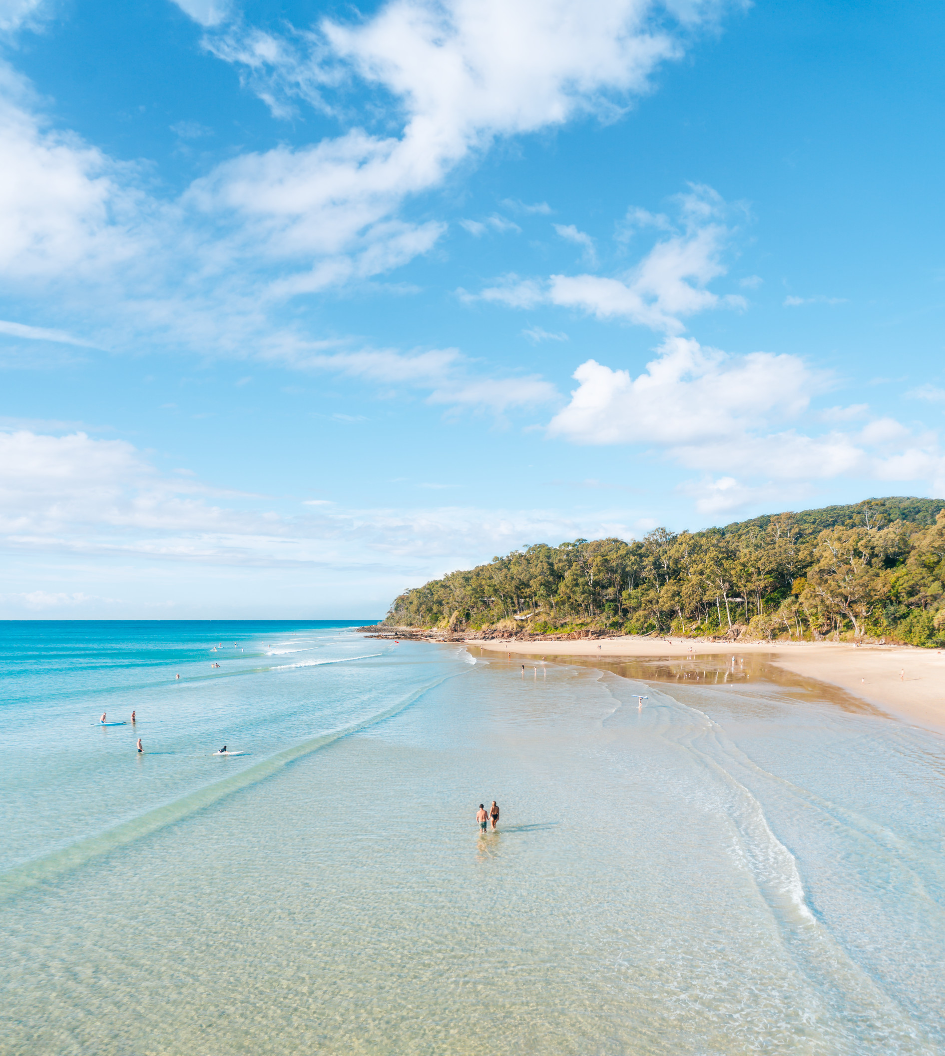 Couple swimming at beach in Noosa