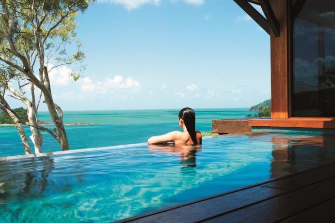 Female adult looking out over the ocean from the Qualia Pool on Hamilton Island | The best hotel pools in Queensland Female adult looking out over the ocean from the Qualia Pool on Hamilton Island | The best hotel pools in Queensland
