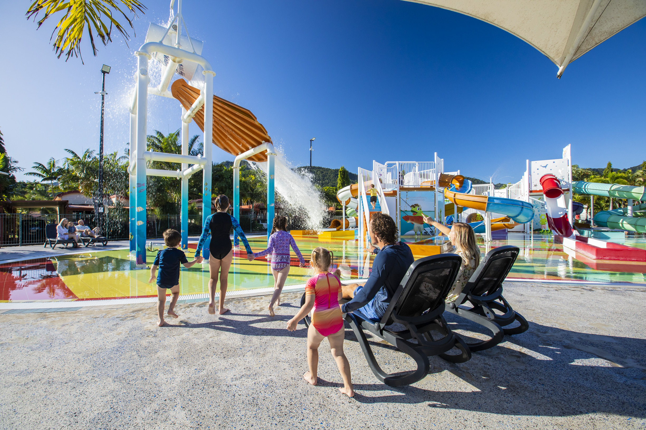 Families enjoying the lagoon swimming pool facilities, BIG4 Adventure Whitsunday Resort | Airlie Beach accommodation guide Families enjoying the lagoon swimming pool facilities, BIG4 Adventure Whitsunday Resort | Airlie Beach accommodation guide