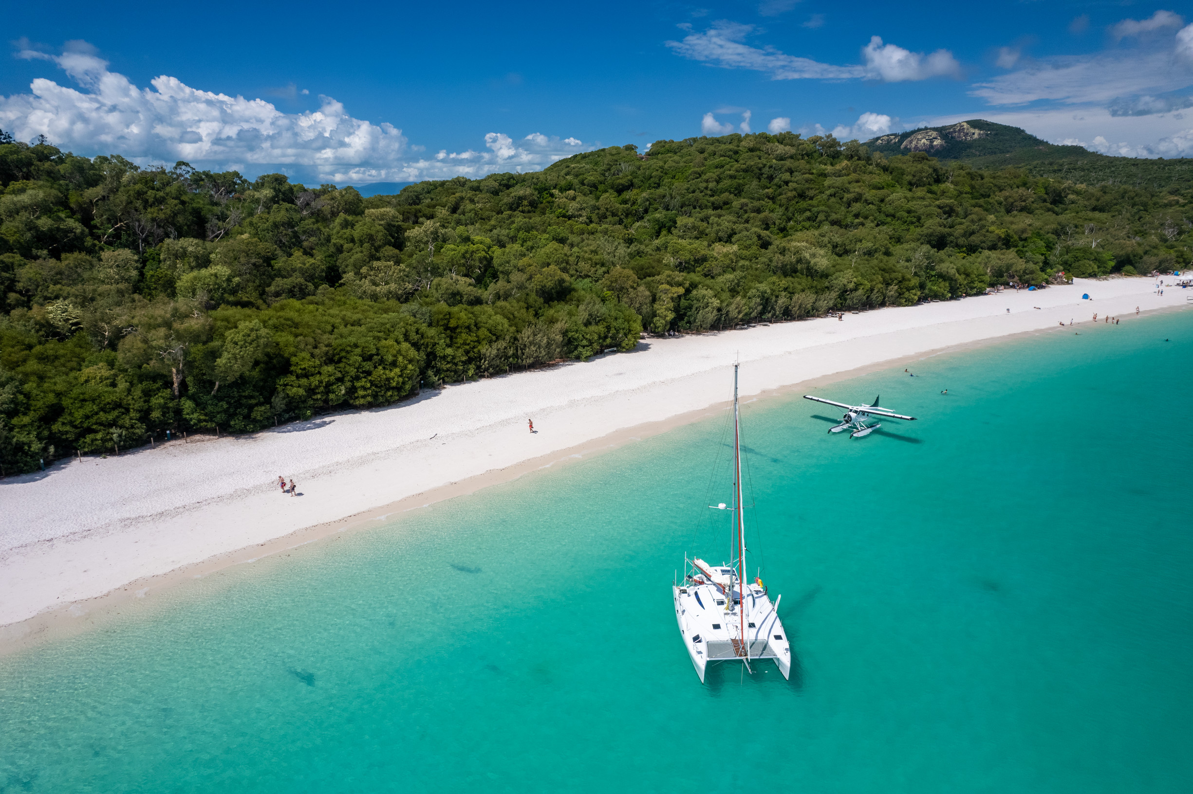 Catamarans and seaplanes pulled into Whitehaven Beach Whitsunday Island | family sailing holiday whitsundays Catamarans and seaplanes pulled into Whitehaven Beach Whitsunday Island | family sailing holiday whitsundays