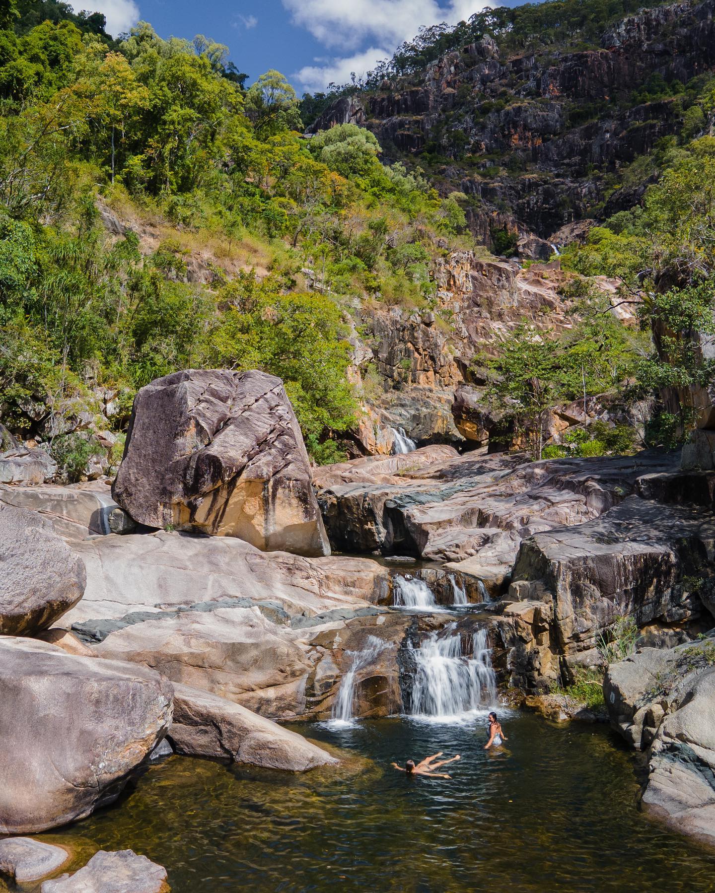 People swimming in the water at Jourama Falls People swimming in the water at Jourama Falls