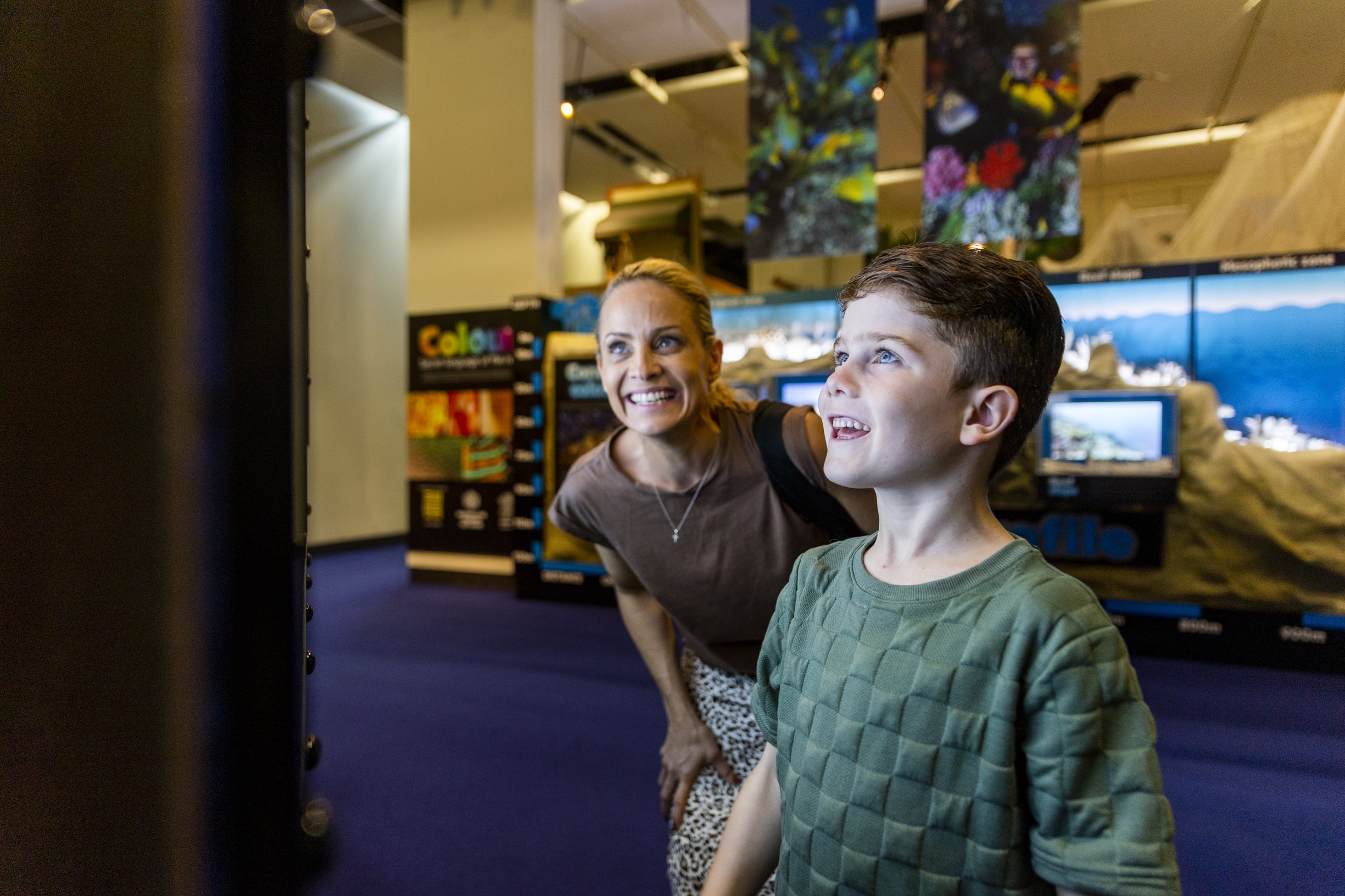 Mother and son discovering the exhibits at Museum of Tropical Queensland, which explores the natural history, archaeology and history of tropical Queensland Mother and son discovering the exhibits at Museum of Tropical Queensland, which explores the natural history, archaeology and history of tropical Queensland