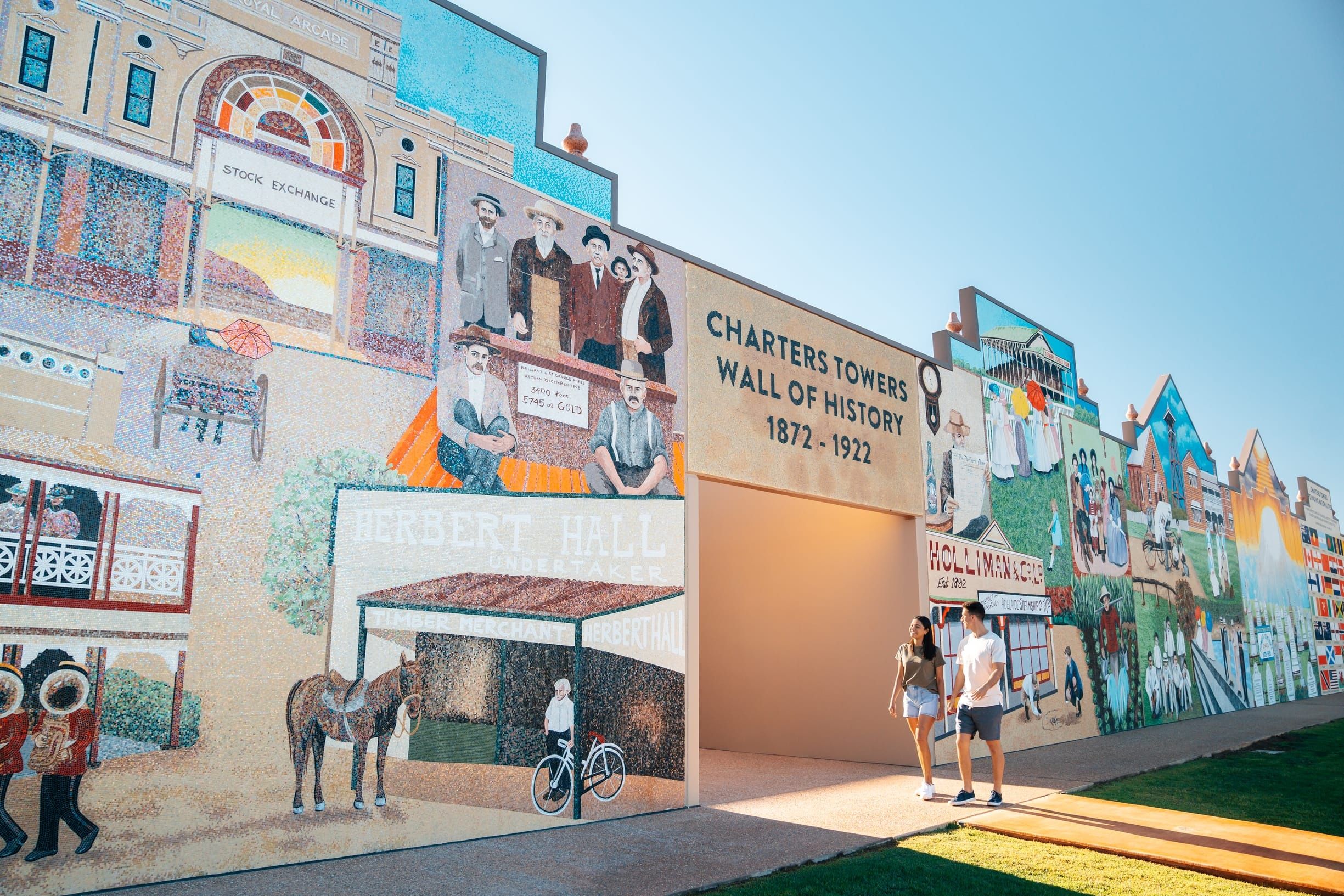 Australia's largest hand-made mosaic and depicts the accidental discovery of gold by JuCouple walk by Charters Towers' Goldtower Central Wall of History - a handmade mosaic that depicts the accidental discovery of gold by Jupiter Mosmanpiter Mosman